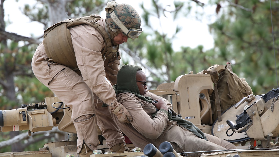 Marines with Tank Platoon, Company B, Ground Combat Element Integrated Task Force, conduct a casualty evacuation drill on the outside trails of Landing Zone Hawk at Marine Corps Base Camp Lejeune, North Carolina, Nov. 13, 2014. From October 2014 to July 2015, the GCEITF will conduct individual and collective level skills training in designated ground combat arms occupational specialties in order to facilitate the standards based assessment of the physical performance of Marines in a simulated operating environment performing specific ground combat arms tasks. 