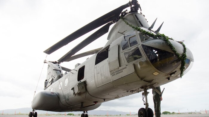 Service members and civilians attended a sunset ceremony honoring the CH-46E Sea Knight at the Pacific Aviation Museum aboard Ford Island, Nov. 6, 2014. The Marine Corps will finish phasing out the Sea Knight by next year. The aircraft at the ceremony is now part of the museum’s aircraft collection.