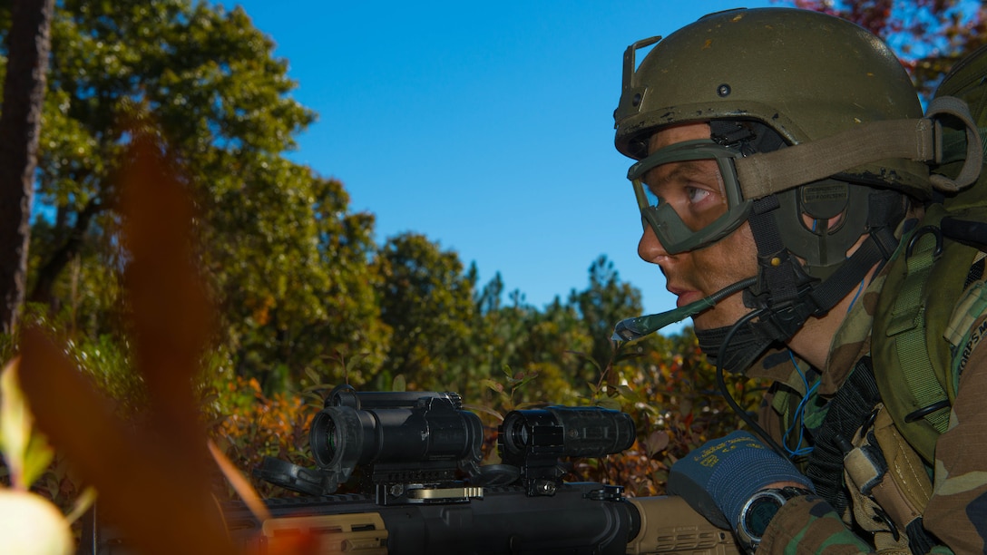 Royal Netherlands Korps Mariniers wait for orders to assault a combat town in Marine Corps Base Camp Lejeune, North Carolina on Nov. 7, 2014. This was one of the many training events of Bold Alligator 2014. A large-scale amphibious exercise on the East Coast designed to improve U.S. and allied forces response to a myriad of different crises.