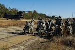 U.S. Army Soldiers, assigned to the 1-118th Combined Arms Battalion, South Carolina Army National Guard, assault a captured electrical facility at the Savannah River Site, Aiken, S.C., as part of Carolina Thunder 14, Nov. 15, 2014. South Carolina National Guard, along with North Carolina, Georgia, and Tennessee National Guard units, conducted Carolina Thunder 14, joint training exercise, on a drill weekend. 