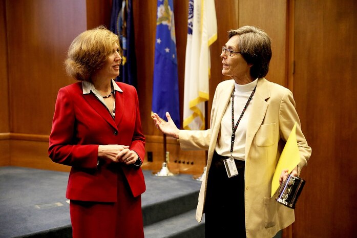 Jeanette Evans-Morgis (left), chairwoman for Marine Corps Females in Technology, speaks to keynote speaker Mary Lacey, deputy assistant secretary of the Navy for Research, Development, Test and Evaluation, during the “Making Connections” forum Nov. 13 at the Gray Research Center on Marine Corps Base Quantico, Virginia. MC-FIT is a new organization sponsored by the Marine Corps Systems Command engineering competency. 