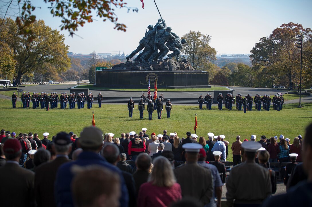 The parade commander from Marine Barracks Washington, D.C., calls the battalion to attention during a wreath laying ceremony at the Marine Corps War Memorial in Arlington, Va., on Nov. 10, 2014. The wreath laying ceremony occurs every year on the Marine Corps’ birthday. (U.S. Marine Corps photo by Lance Cpl. Christian Varney)