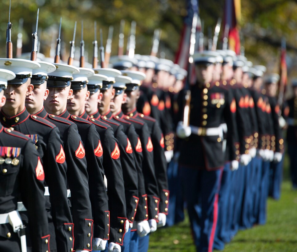 Ceremonial marchers from Marine Barracks Washington, D.C., pass in review during a wreath laying ceremony parade on Nov. 10, 2014 at the Marine Corps War Memorial in Arlington, Va. The wreath laying ceremony occurs every year in celebration of the Marine Corps' Birthday. (U.S. Marine Corps photo by Lance Cpl. Christian Varney)