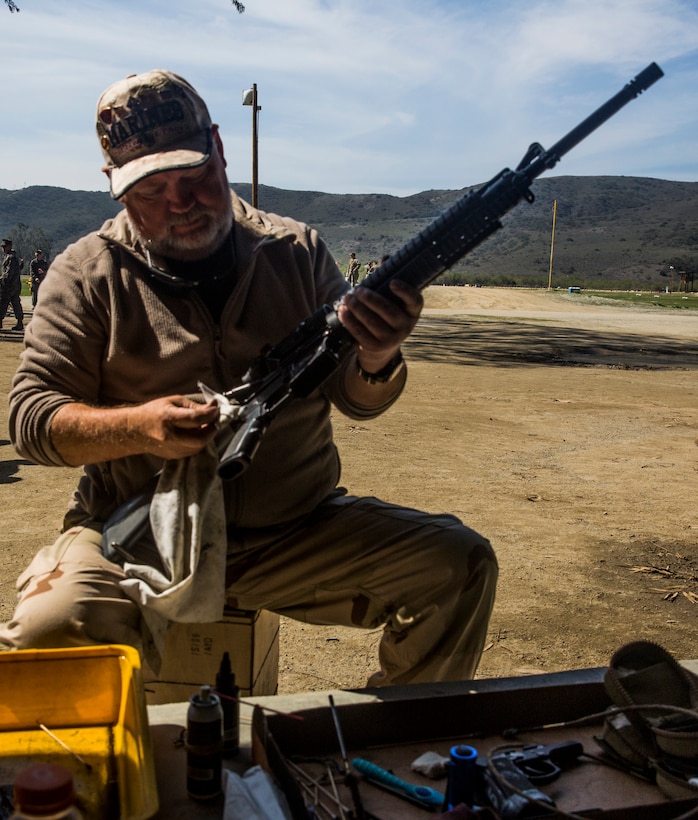 William H. Frye, a former Marine and native of Saint Paul, Minn., cleans his rifle at Wilcox Range aboard Marine Corps Base Camp Pendleton, Calif., March 6.


