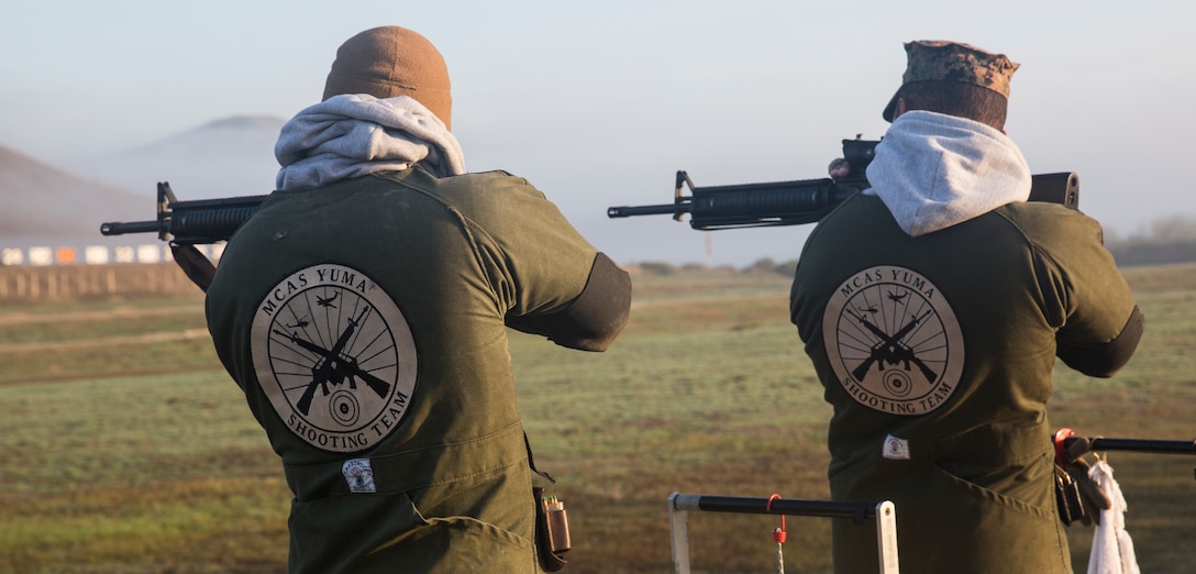 Corporal Keontaye Dawson (left), a range coach for Marine Corps Air Station Yuma, Ariz., and Staff Sgt. James Lyons, the staff noncommissioned officer in charge of MCAS Yuma’s ranges, sight-in prior to the initiation of the Competition-In-Arms Program Western Divisional team rifle match at Wilcox Range aboard Marine Corps Base Camp Pendleton, Calif., March 5.