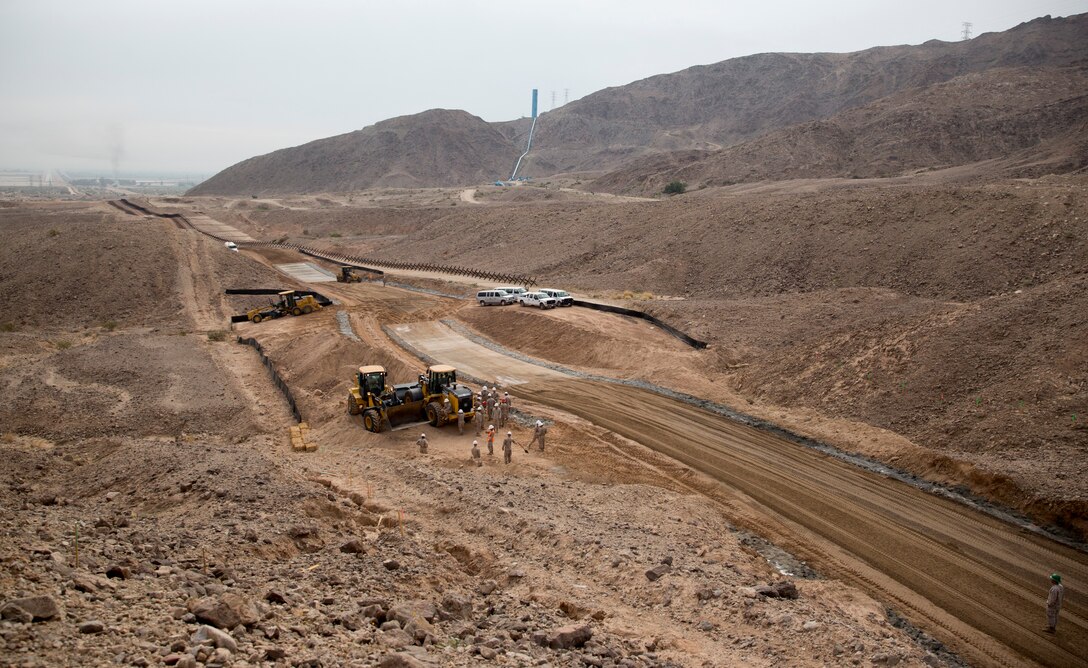 Marines with Marine Wing Support 371, based in Marine Corps Air Station Yuma, Ariz., and 7th Engineer Support Battalion, based in Marine Corps Base Camp Pendleton, Calif., take part in the West Desert El Centro All Weather Road Improvements at the U.S./Mexico Border in El Centro, Calif., Feb. 25.