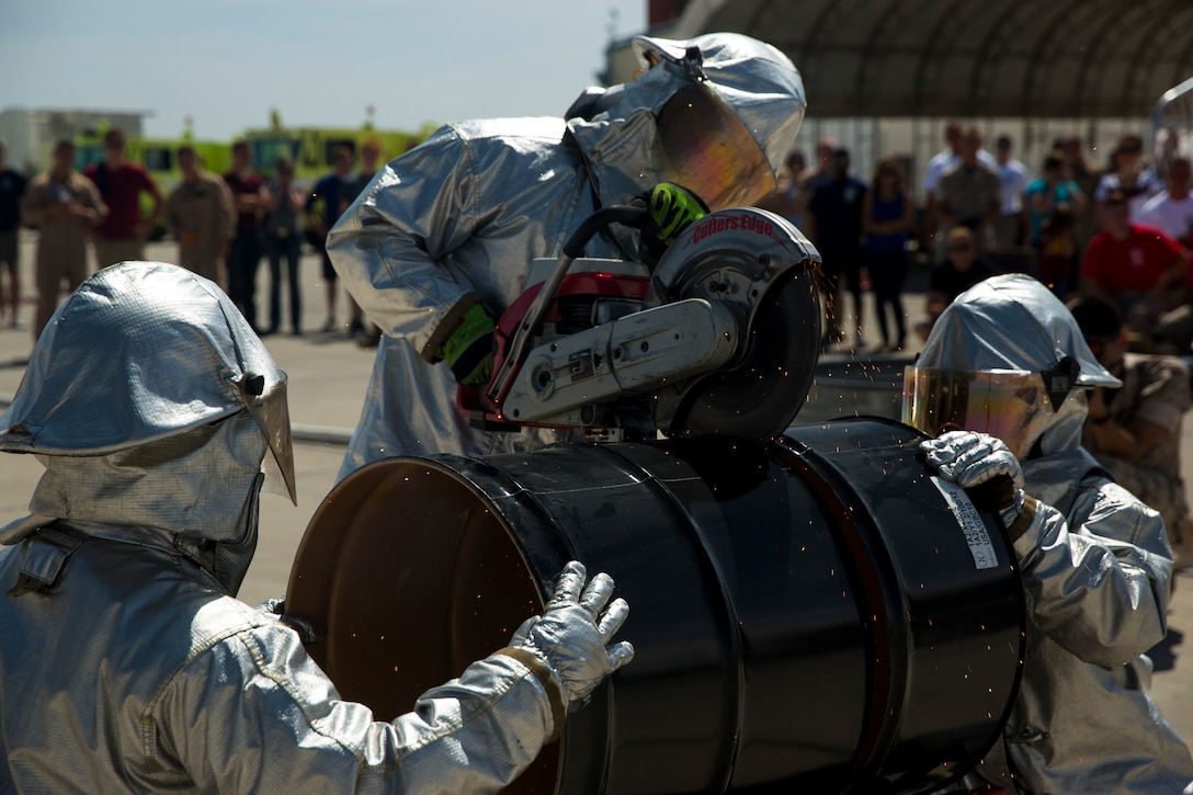 Aircraft Rescue and Fire Fighting Marines saw through a barrel as part of the 3rd Annual ARFF Rodeo Competition at Marine Corps Air Station Yuma, Ariz., Saturday. This year Marine Corps Base Camp Pendleton finished first place for the third consecutive year. MCAS Yuma took second and MCAS Miramar placed third. 