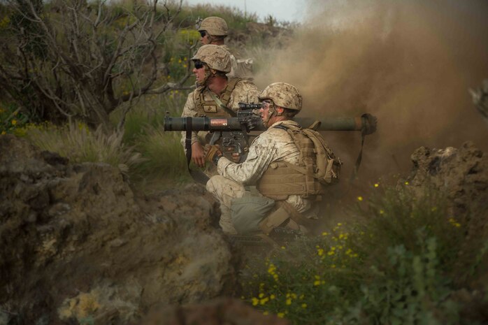 POHAKULOA TRAINING AREA, Hawaii - Lance Cpl. Damon Saunders and Lance Cpl. Bradley Saunder, assaultmen with Fox Company, 2nd Battalion, 3rd Marine Regiment, fire a Shoulder-launched Multipurpose Assault Weapon while training on Range 10, at Pohakuloa Training Area, Nov. 6, 2014. (U.S. Marine Corps photo by Lance Cpl. Brittney Vella)