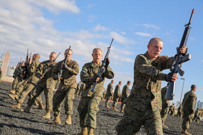 Recruits of Mike Company, 3rd Recruit Training Battalion, execute a left block with a dummy M16-A4 Service Rifle during the Marine Corps Martial Arts Program test aboard Marine Corps Recruit Depot San Diego, Nov. 12.  Recruits were taught hand-to-hand and weapon strike techniques over the course of recruit training.