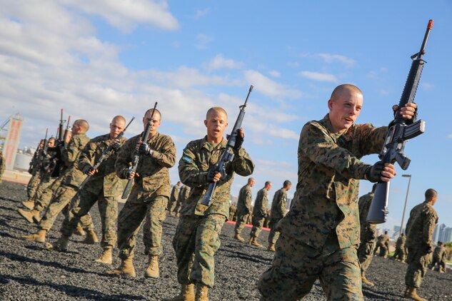 Recruits of Mike Company, 3rd Recruit Training Battalion, execute a left block with a dummy M16-A4 Service Rifle during the Marine Corps Martial Arts Program test aboard Marine Corps Recruit Depot San Diego, Nov. 12.  Recruits were taught hand-to-hand and weapon strike techniques over the course of recruit training.