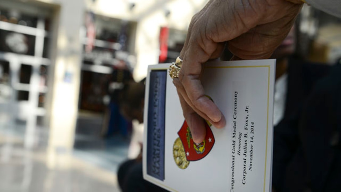 Honorable Senator Mark R. Warner delivers remarks at the National Museum of the Marine Corps to remember fallen Montford Marine, Cpl. Julius B. Foxx, during his Congressional Gold Medal ceremony, Nov. 14.  Nearly seven decades ago, as our Nation was at war, more than 2,000 African-American men enlisted in the United States Marine Corps with Foxx being one of many Marines who served with distinction during some of World War II’s bloodiest struggles after completing arduous and segregated basic training at Montford Point Camp. (U.S. Marine Corps Photo By Sgt. Jose D. Lujano/Released)