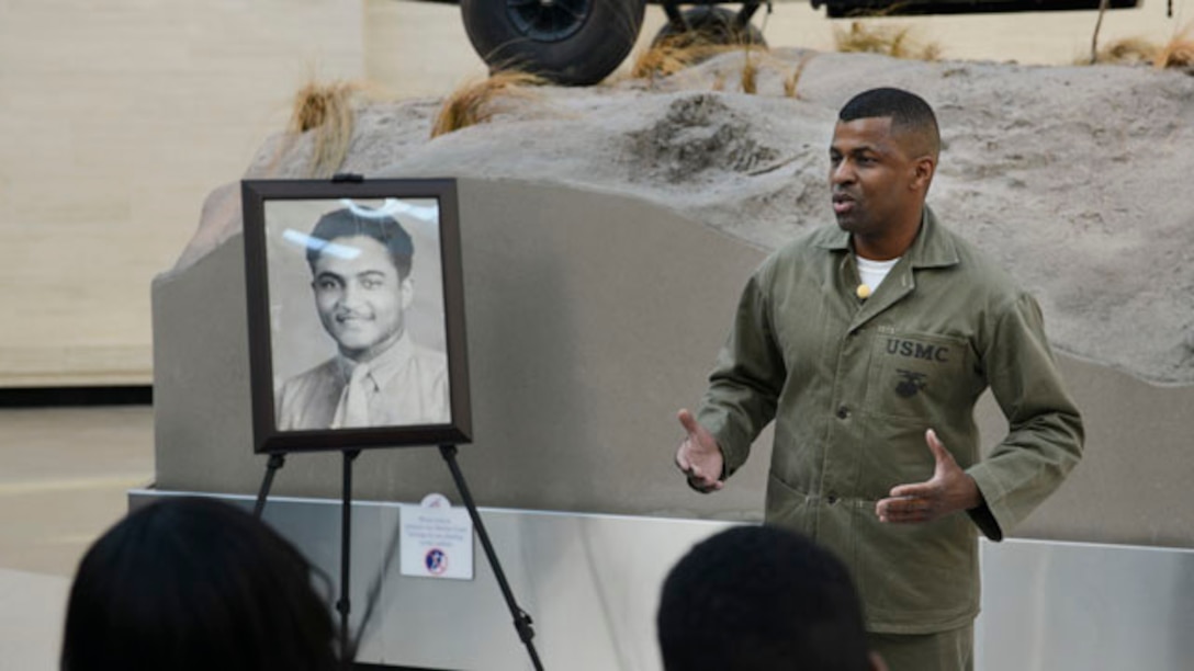 Sheila Foxx, left, and Sharon Foxx, right received awards at the National Museum of the Marine Corps to remember their father and a fallen Montford Marine, Cpl. Julius B. Foxx, during Foxx’s Congressional Gold Medal ceremony, Nov. 14.  The Congressional Gold Medal, the highest civilian award in the United States, was given to honor the Montford Point Marines, the first African-Americans allowed to enlist in the Marine Corps. (U.S. Marine Corps Photo By Sgt. Jose D. Lujano/Released)