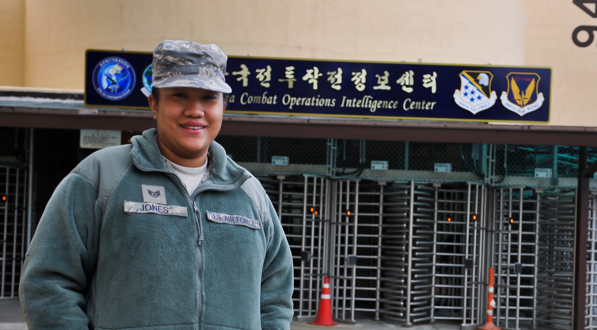 Staff Sgt. Paris Jones, 6th Intelligence Squadron geospatial intelligence supervisor, stands in front of the Korea Combat Operations Intelligence Center Nov. 12, 2014, on Osan Air Base, Republic of Korea. Jones is this week's Airman Spotlight winner. (U.S. Air Force photo by Senior Airman David Owsianka)