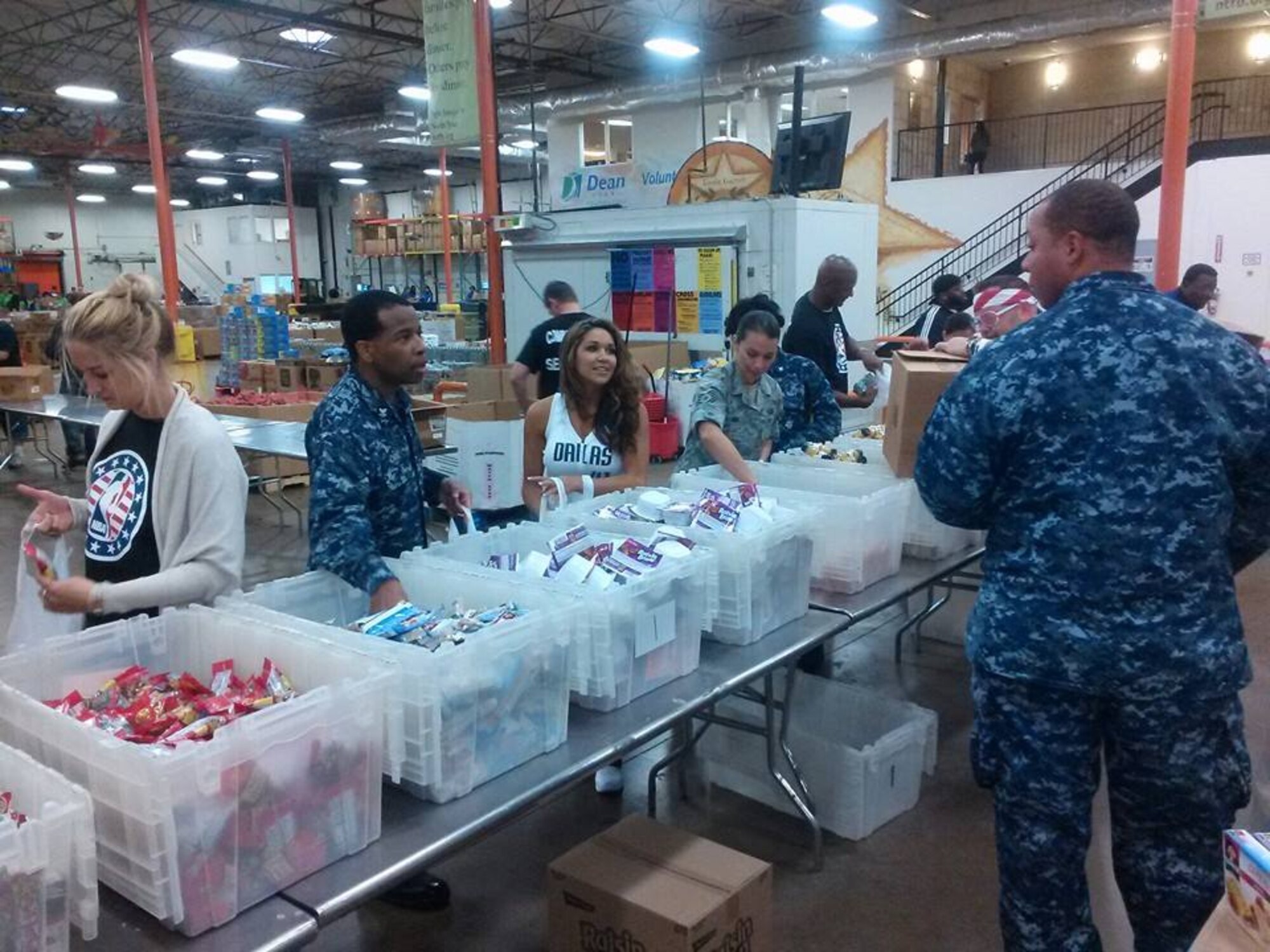 NAVAL AIR STATION FORT WORTH JOINT RESERVE BASE, Texas - Twenty servicemembers from all of branches of service participated in the Dallas Maverick's Hoops for Troops at the North Texas Food Bank in Dallas, Texas Nov. 5. The Hoops for Troops also kicked off the Commitment to Service program. This Defense Department initiative brings service members and athletes together to service their communities. (U.S. Air Force photo/Tech. Sgt. Shawn McCowan)