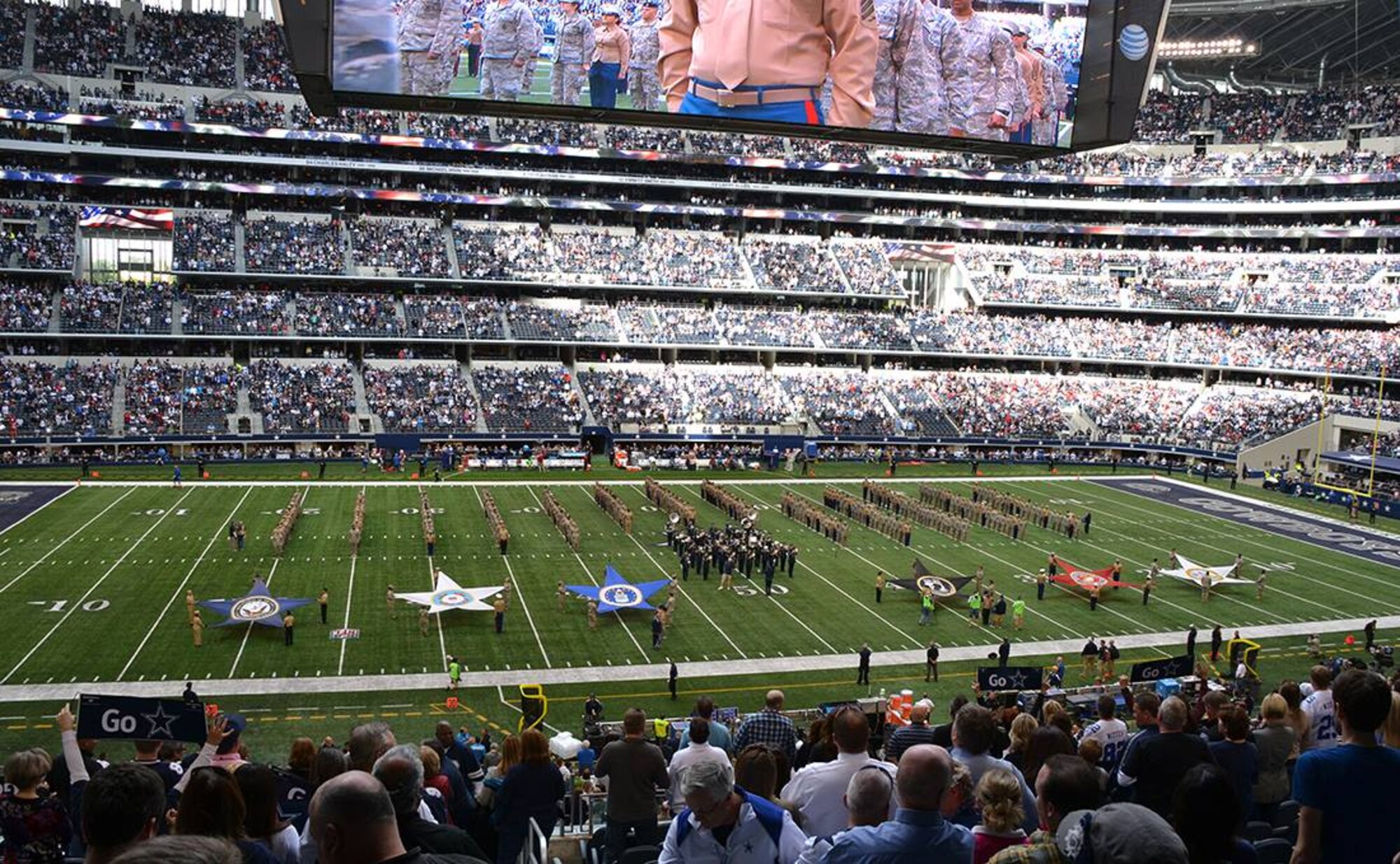 NAVAL AIR STATION FORT WORTH JOINT RESERVE BASE, Texas - More than 350 members from all branches of service participate in the pre-game flag unfolding during a Cowboys' home game Nov. 2. Members honored each service by displaying its flag. (U.S. Air Force photo/Darryl Collins)