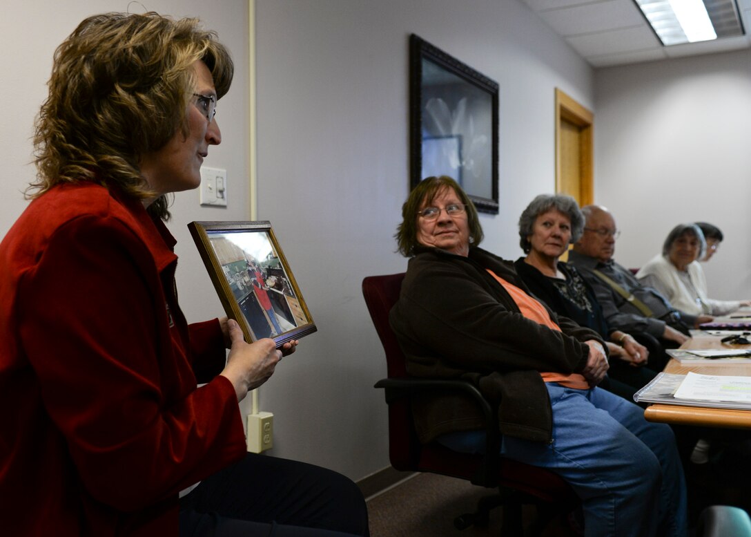 Kimberly Geffre, Airman and Family Readiness Center casualty assistance representative, shares a personal story about her mother during a Who Gets Grandma’s Yellow Pie Plate class at the Rushmore Center at Ellsworth Air Force Base, S.D., Nov. 7, 2014. Class attendees were equipped with the necessary tools to help them plan and organize the transfer of personal property following the passing of a loved one.  (U.S. Air Force photo by Senior Airman Anania Tekurio/Released) 