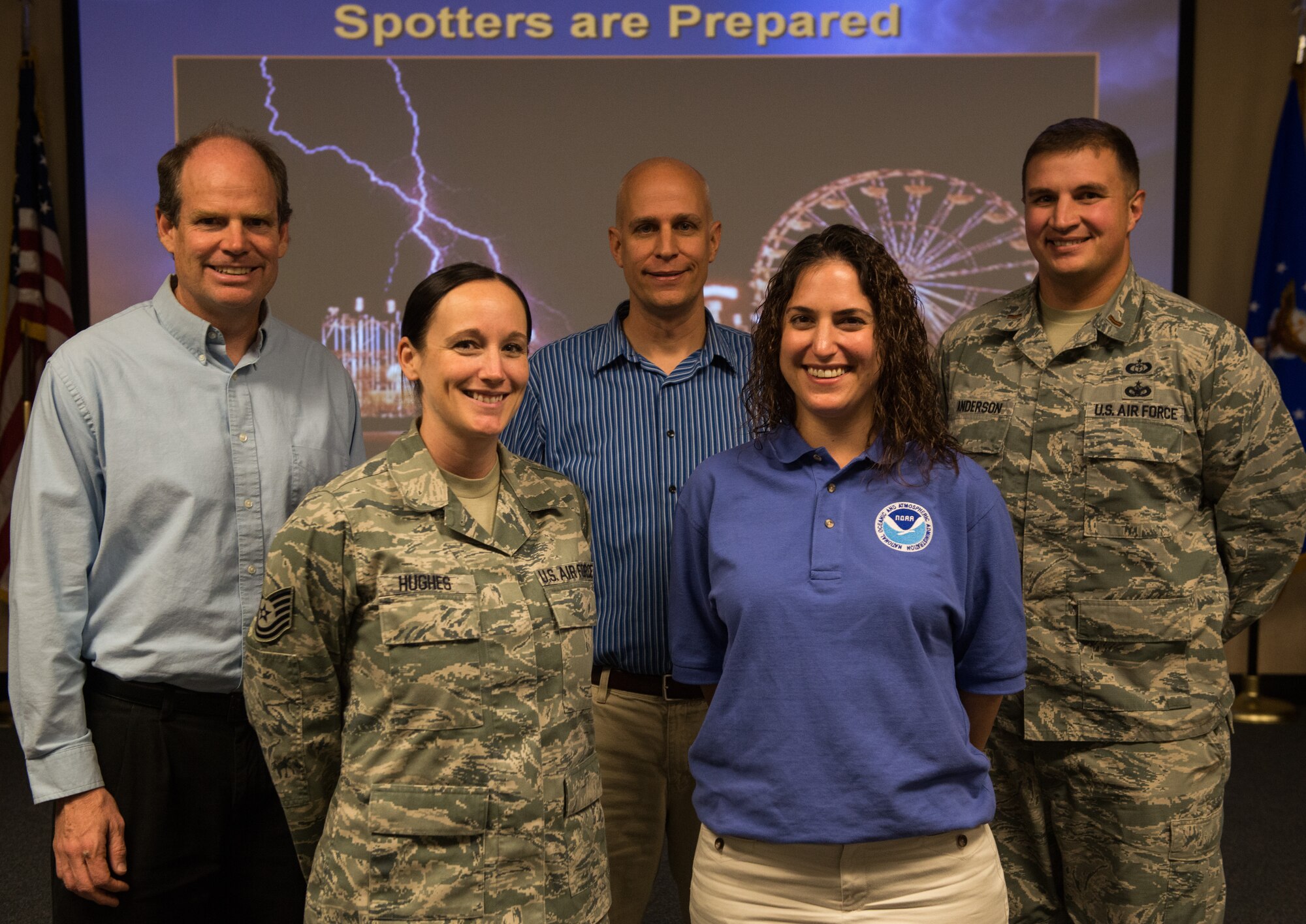 National Weather Service meteorologists pose for a photo with 366th Operations Support Squadron weather flight personnel after a briefing Nov. 11, 2014, at Mountain Home Air Force Base, Idaho. The NWS presented Airmen and base residents with severe weather response information aimed to better prepare the public for inclement weather. (U.S. Air Force photo by Airman Connor J. Marth/RELEASED)