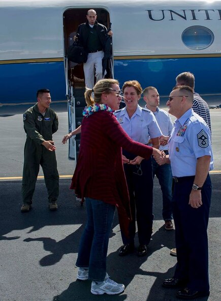 Secretary of the Air Force Deborah Lee James shakes hands with Chief Master Sgt. Harold Huctchison, Pacific Air Forces command chief, after Lee's arrival at Joint Base Pearl Harbor-Hickam, Hawaii, Nov. 16, 2014. (U.S. Air Force photo by Tech. Sgt. Terri Paden/RELEASED)
