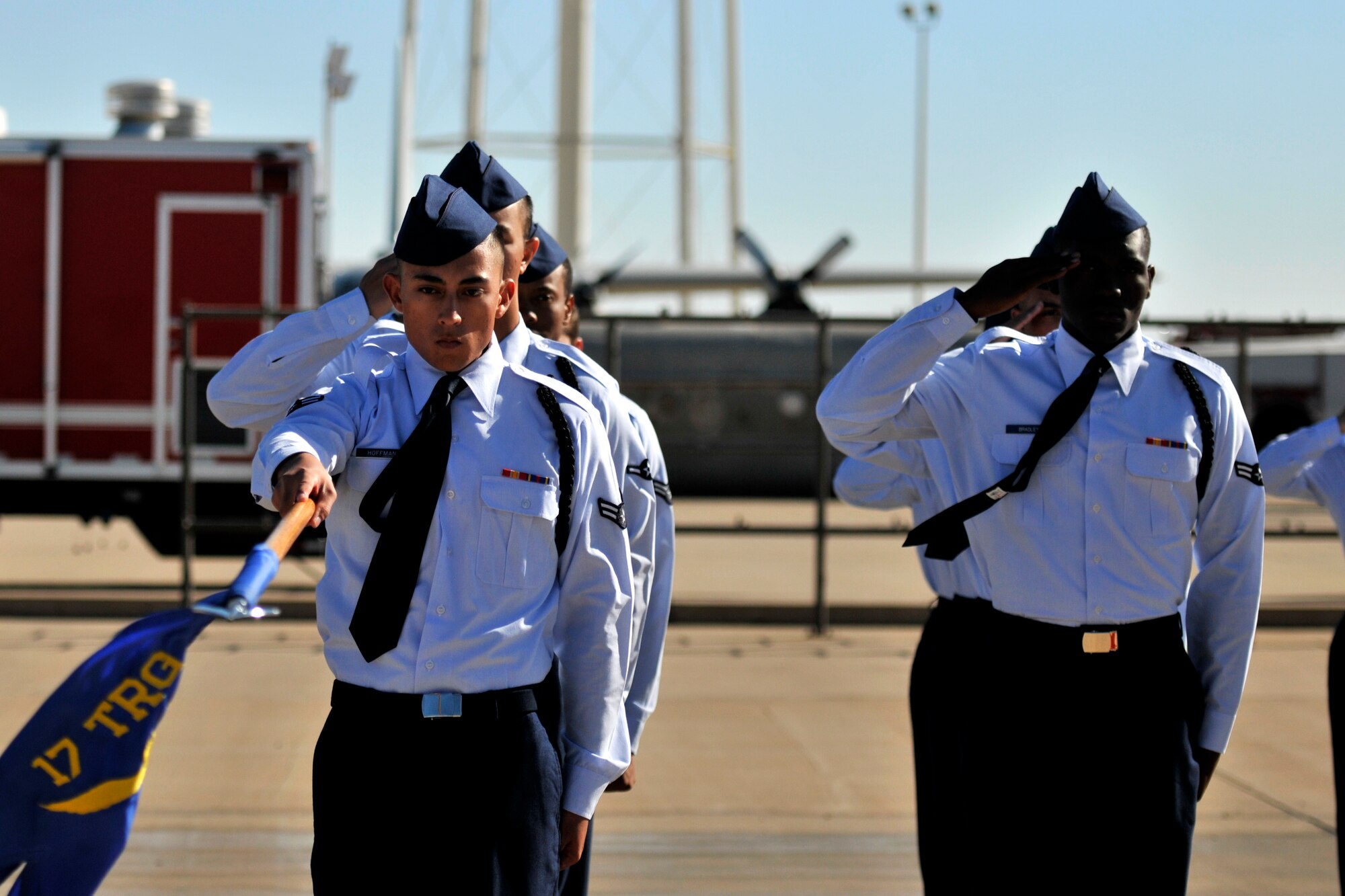 GOODFELLOW AIR FORCE BASE, Texas – A 312th Training Squadron formation salute to the singing of the national anthem for Community Appreciation Day at the Louis F. Garland Department of Defense Fire Academy Nov. 15. The 312th TRS won the drill competition tournament. (U.S. Air Force photo/ Airman 1st Class Scott Jackson)