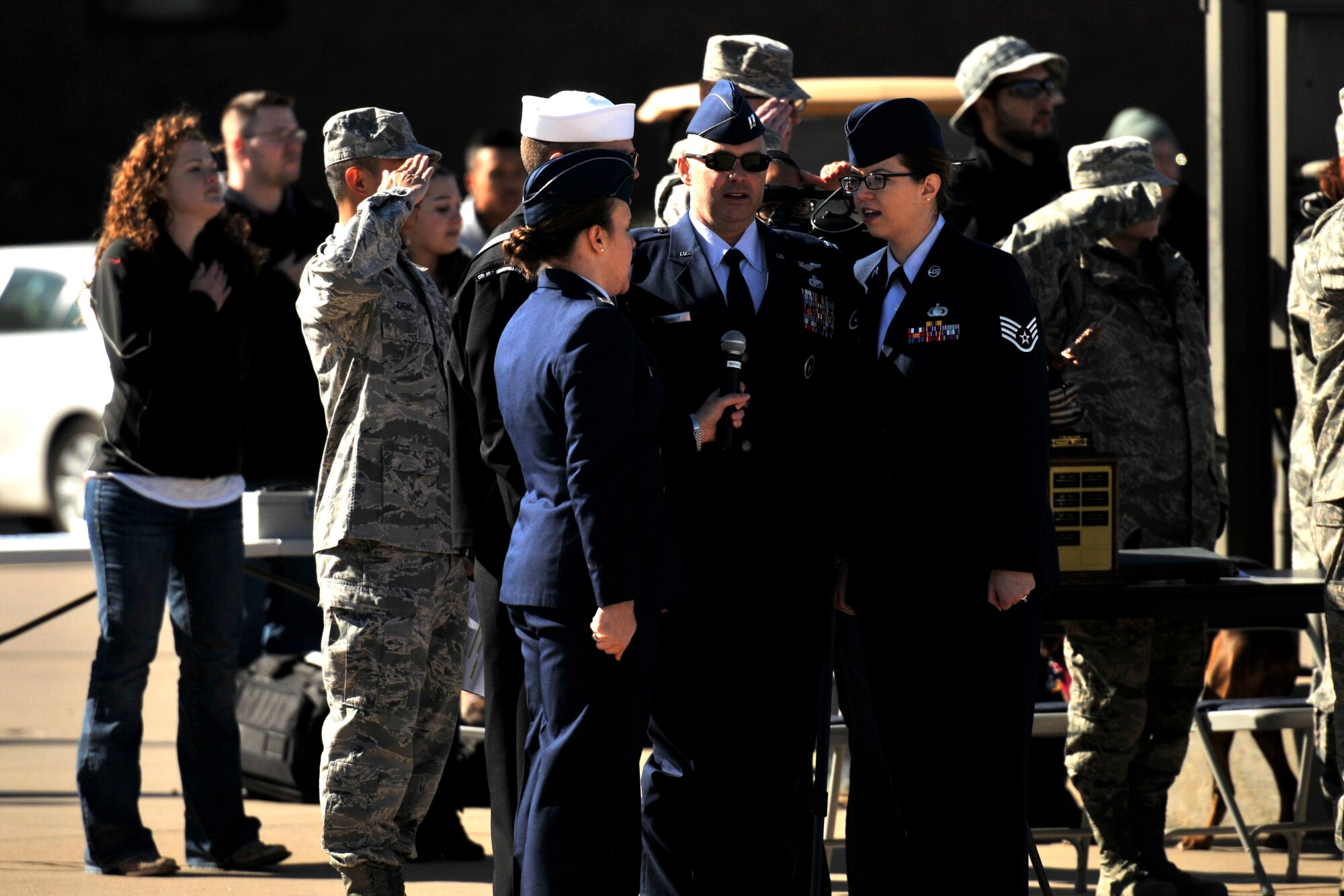 GOODFELLOW AIR FORCE BASE, Texas – Goodfellow singing group Patriotic Blue sing the national anthem, beginning the drill competition during Community Appreciation Day at the Louis F. Garland Department of Defense Fire Academy day Nov. 15. Community appreciation day is an annual event, where the base is open to the public to create a unified environment for both Goodfellow and the local community. (U.S. Air Force photo/ Airman 1st Class Scott Jackson)