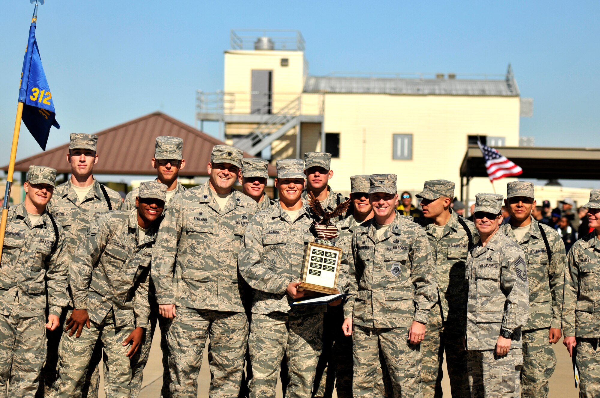 GOODFELLOW AIR FORCE BASE, Texas – The 312th Training Squadron presents a trophy for being the overall winner during a drill competition for Community Appreciation day at the Louis F. Garland Department of Defense Fire Academy Nov. 15. The trophy is awarded for their creativity, military bearing, and execution. (U.S. Air Force photo/ Airman 1st Class Scott Jackson)