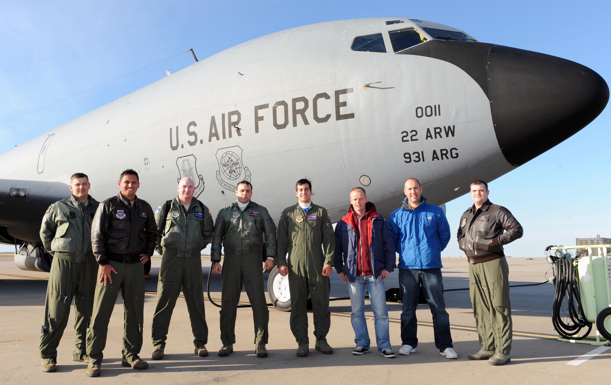 Aircrew members and two Dutch air traffic controllers pose for a photo, Nov. 14, at McConnell Air Force Base, Kan. The Dutchmen visited McConnell to familiarize themselves with air refueling and other aircraft maneuvers in order to improve communication and better assist U.S. forces. (U.S. Air Force photo/Airman 1st Class David Bernal Del Agua)