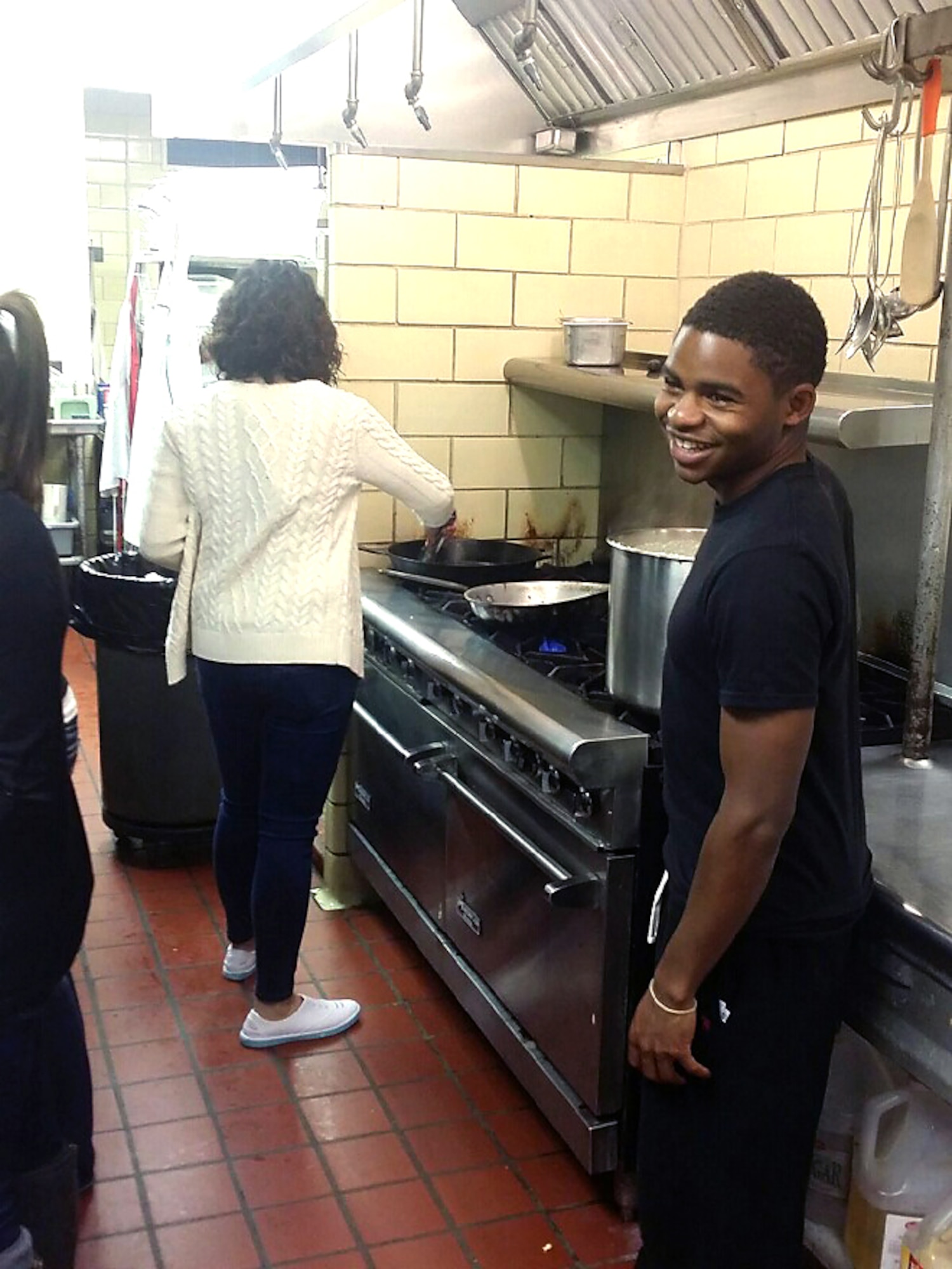Junior enlisted service members from Offutt Air Force Base prepare and serve meals at the Stephen Center homeless shelter in Omaha, Neb. The members volunteered for the activity through “The Connection,” an Offutt program that provides fellowship and professional development to Offutt’s junior enlisted service members. (Courtesy photo)