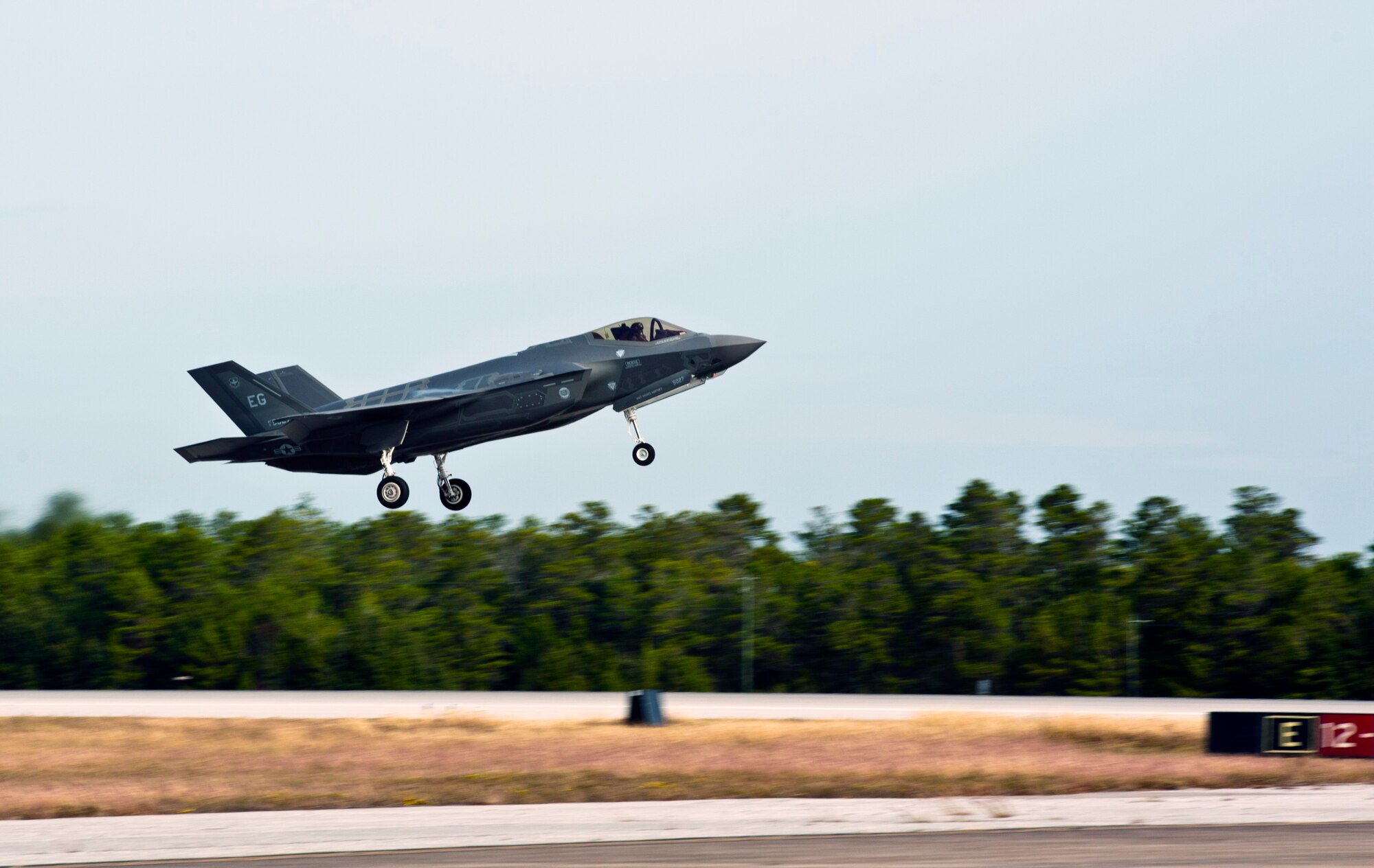 An F-35A Lightning II takes off for an integrated training mission on Eglin Air Force Base, Florida, Nov. 5, 2014. The U.S. Air Force deployed four F-22A Raptors from Joint Base Langley-Eustis, Virginia, to Eglin Air Force Base, Florida, for the first operational integration training mission with the F-35A Lightning II assigned to the 33rd Fighter Wing. The purpose of the training was to improve integrated employment of fifth-generation assets and tactics. (U.S. Air Force photo/Staff Sgt. Marleah Robertson)