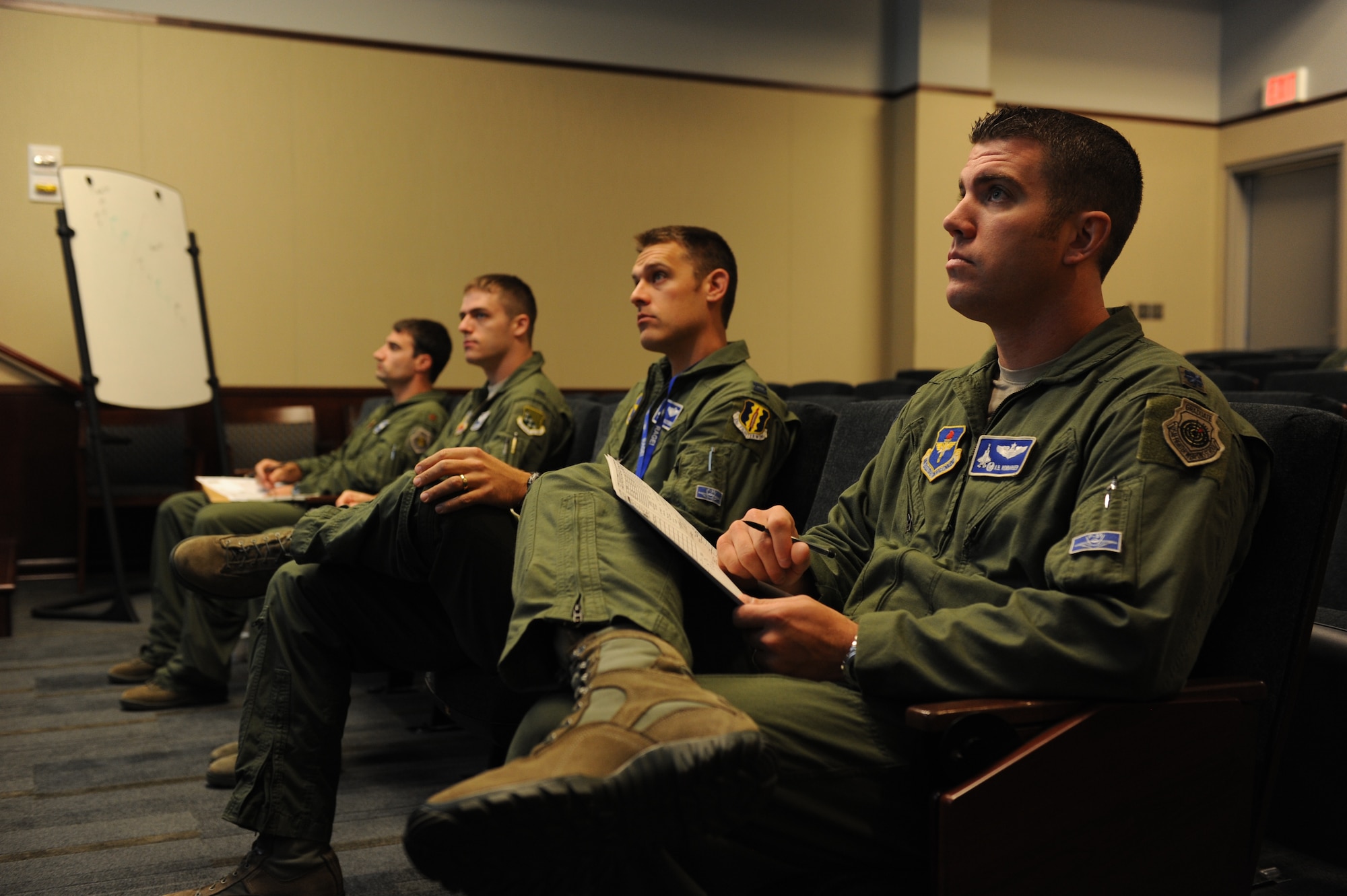 F-35A Lightning II and F-22 Raptor pilots listen to a preflight briefing before an integrated training mission on Eglin Air Force Base, Florida, Nov. 5, 2014. The F-35s and F-22s flew offensive counter air, defensive counter air and interdiction missions together, employing tactics to maximize their fifth-generation capabilities. (U.S. Air Force photo/Staff Sgt. Marleah Robertson)