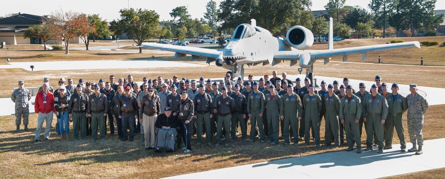 U.S. Air Force retired Col. Frank Epperson, retired Maj. Don Miller and former 1st Lt. J.M. Taylor, all former 75th Fighter Squadron pilots, stand in front of Team Moody during the Flying Tiger Reunion Nov. 14, 2014, at Moody Air Force Base, Ga. Epperson, Miller and Taylor all flew with the 75th FS “Flying Tigers” during World War II. (U.S. Air Force photo by Airman 1st Class Ryan Callaghan/Released)