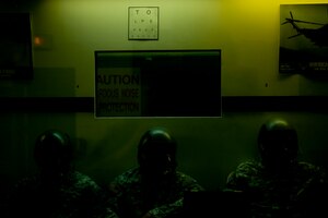 U.S. Army Rangers get used to breathing in their oxygen masks before going through a series of tests in a hypobaric altitude chamber at Langley Air Force Base, Va., Nov. 14, 2014. The chamber reduces pressure around students to create low pressure environments, which are experienced in high altitude.  (U.S. Air Force photo by Staff Sgt. Natasha Stannard/Released)