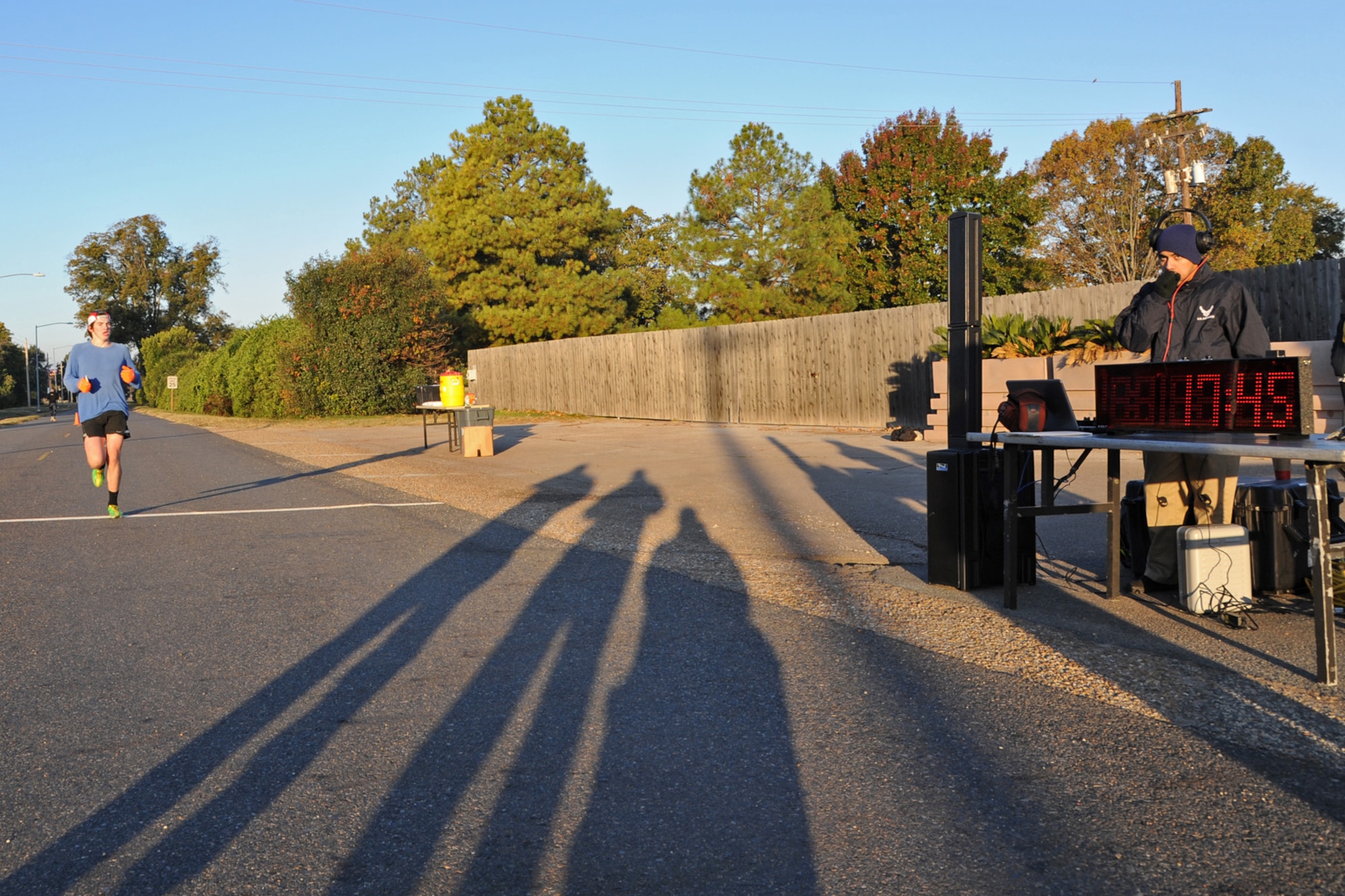 Reed Keen crosses the finish line during the Turkey Trot 5K fun run on Barksdale Air Force Base, La., Nov. 14, 2014. Keen finished in first place with a time of 17:45. (U.S. Air Force photo/ Senior Airman Jannelle Dickey)