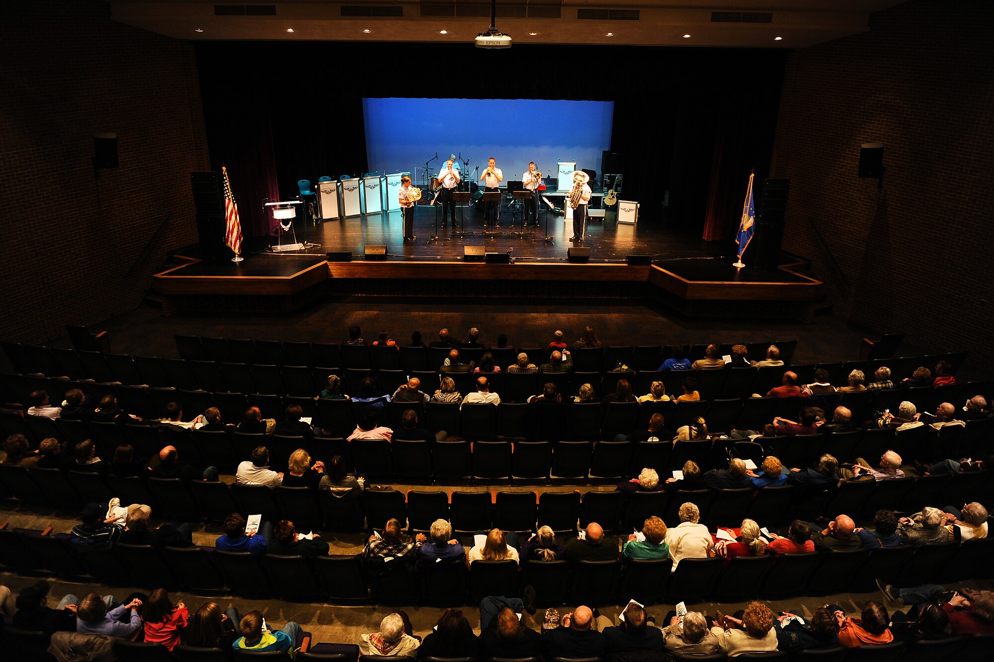 Concert goers take their seats in the Blair High School Theater for a free concert performed by the United States Air Force’s Heartland of America Band on Nov. 8, 2014.  Blair was one of five locations for the Heartland of America Band’s Salute to Veterans concert series.  (U.S. Air Force photo by Josh Plueger/Released)