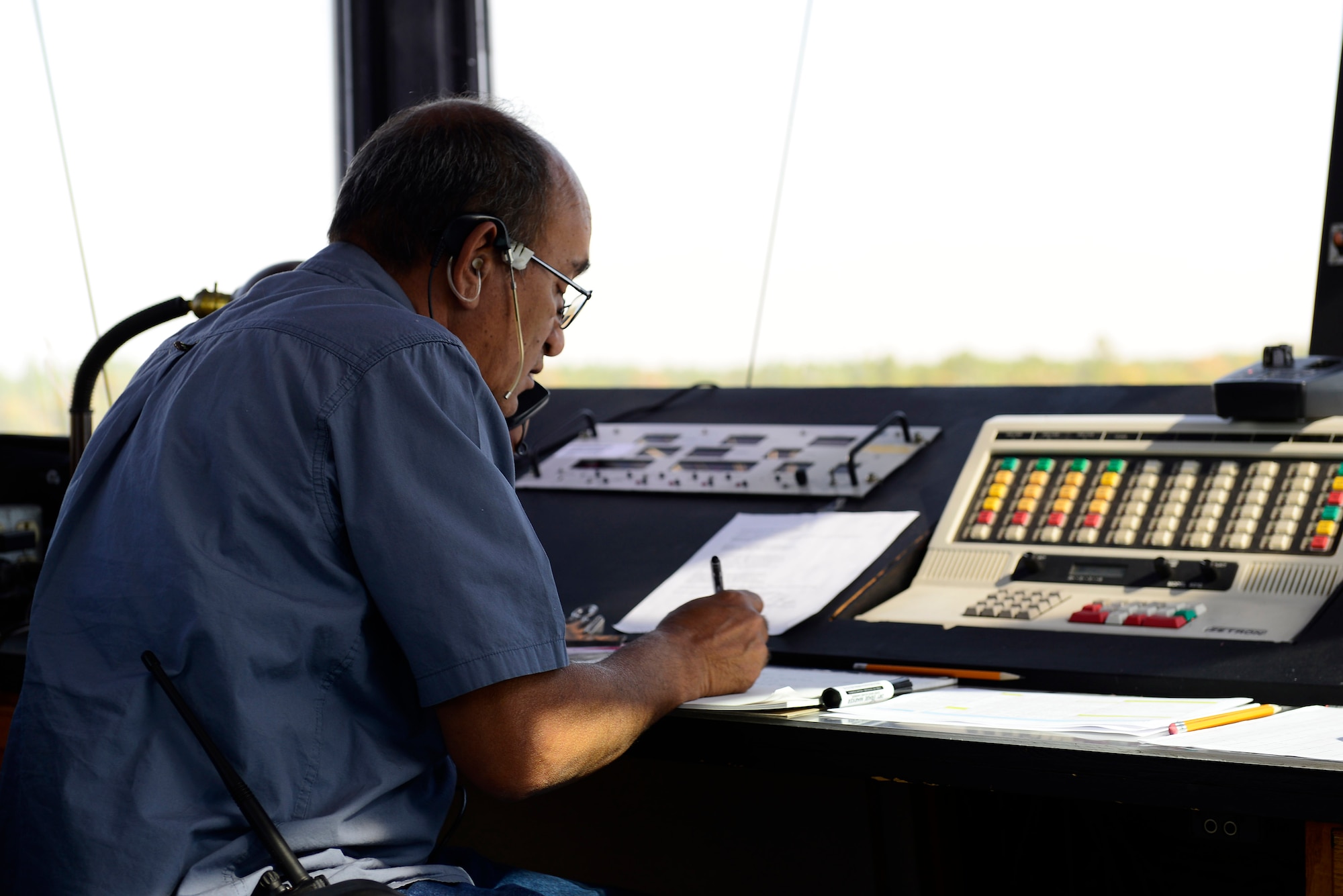 Joseph Blas, 20th Operations Support Squadron lead range control officer, speaks to a pilot during a training mission at Poinsett Electronic Combat Range, Sumter, S.C., Sept. 4, 2014. In 2013, Poinsett had 754 aircraft use its range for training including the F-16CM Fighting Falcon, F-15E Strike Eagle, F/A-18 Super Hornet, UH-60 Black Hawk, and AH-64 Apache. (U.S. Air Force photo by Airman 1st Class Diana M. Cossaboom/Released)