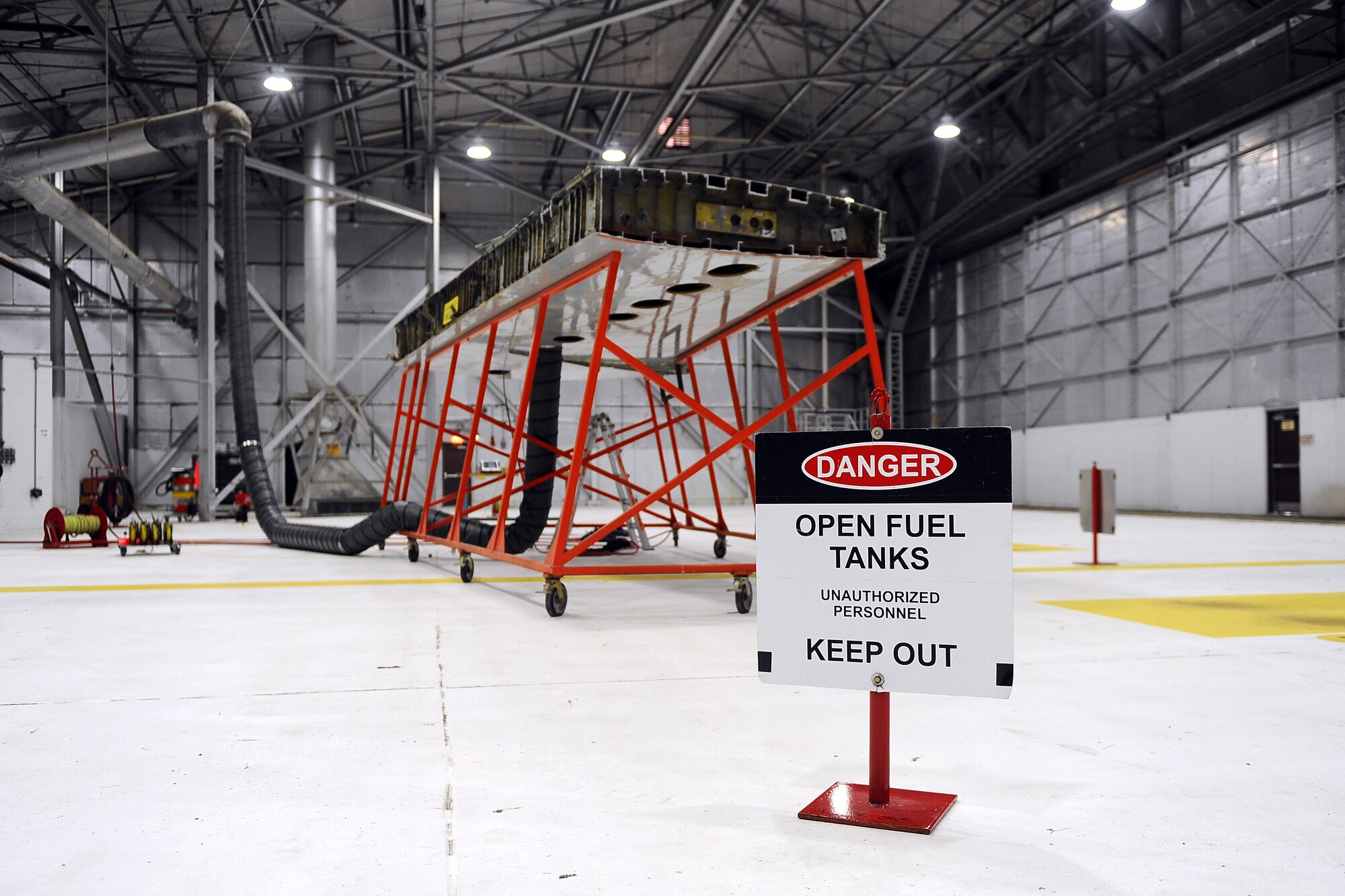 The fuel cell portion of an aircraft wing sits in the middle of 55th Maintenance Squadrons Fuel Systems Repair Shop on Nov. 10 at Offutt Air Force Base, Neb.  The tiny holes underneath are access points that allow the maintainers to crawl inside and make repairs.  Annual rescue training is required in the event that an Airman needs to be retrieved from the cramped workspace.  (U.S. Air Force photo by Josh Plueger/Released)