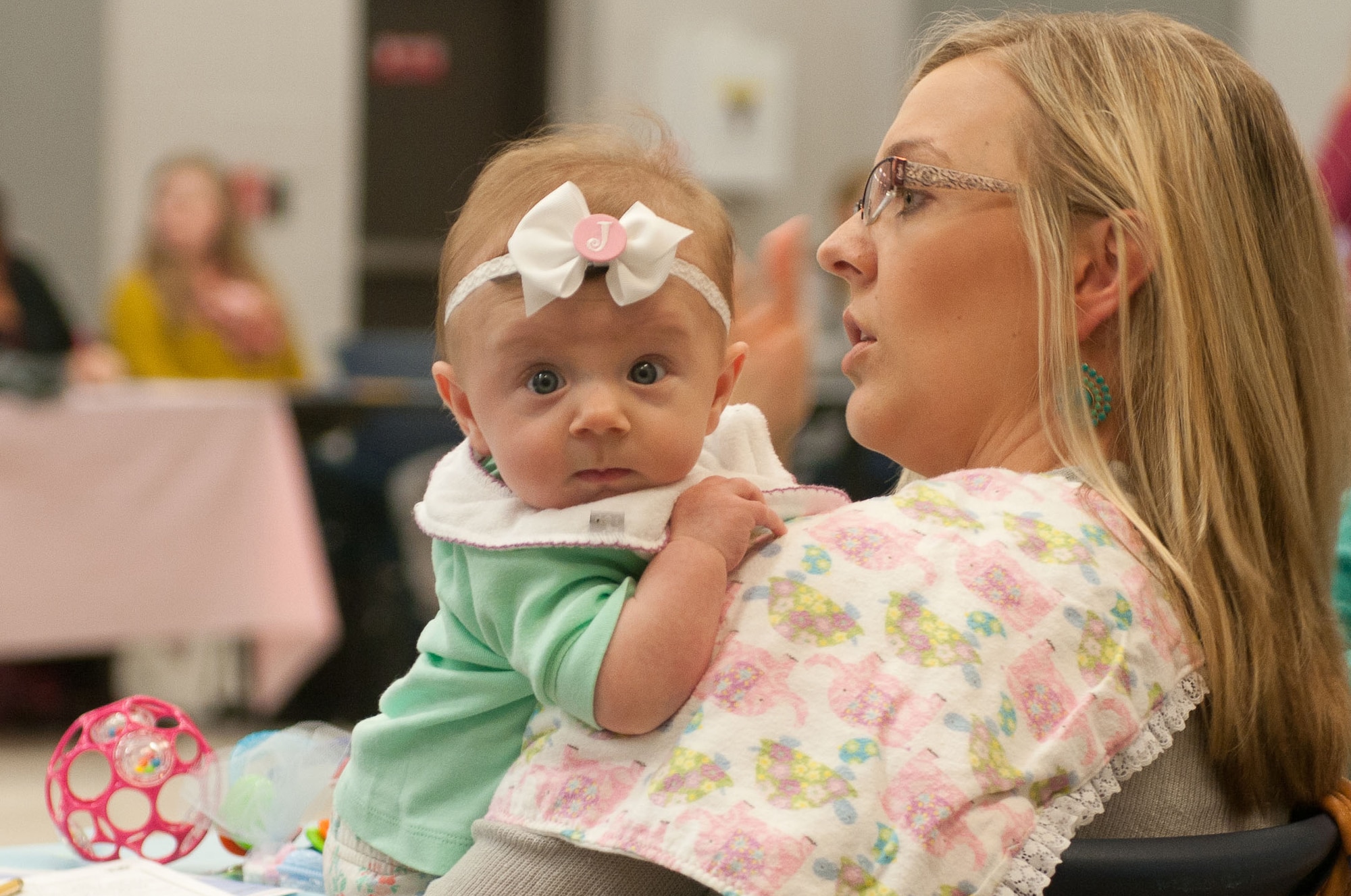 A mom and her baby receive donated items during Operation Baby Shower this past week on Joint Base McGuire-Dix-Lakehurst, N.J. More than $35,000 in donations were distributed to 71 military mothers. (U.S. Army photo by Sgt. 1st Class Raymond Moore/Released)