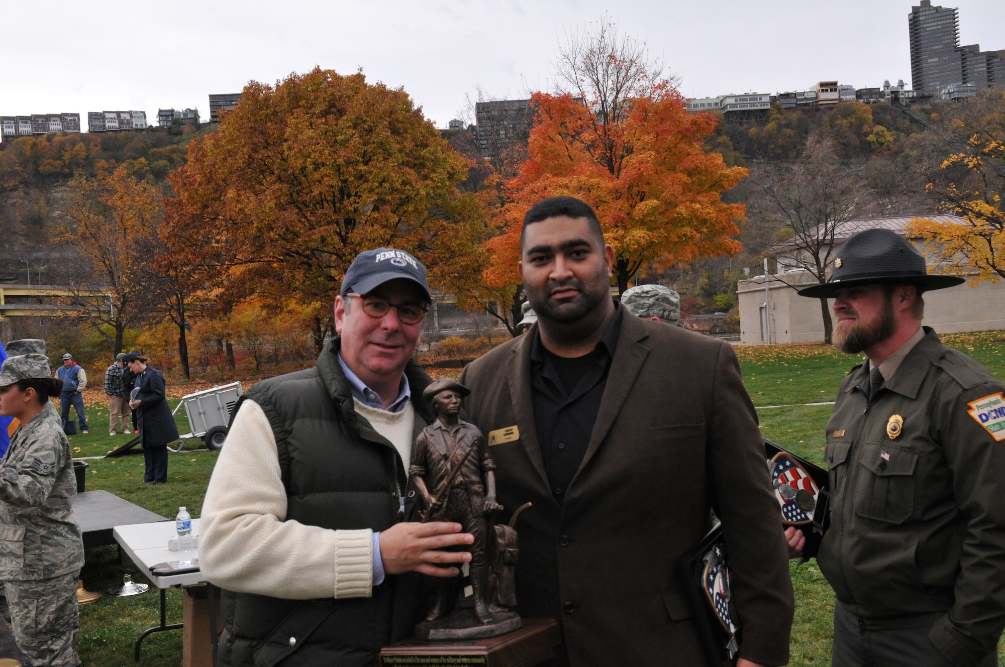 Pittsburgh Mayor Bill Peduto and Carlos Carmona from the Association of the United States Army pose for a photo at the Steel City Salutes the Troops, November 8, 2014.  The Pennsylvania National Guard joined with the Pennsylvania Department of Conservation of Natural Resources' Point State Park and the Association of the United States Army to organize Steel City Salutes the Troops.  The event is a celebration of the region’s military history, community impact and continued relevance. (U.S. Air National Guard photo by Staff Sgt. Michael Fariss/ Released)
