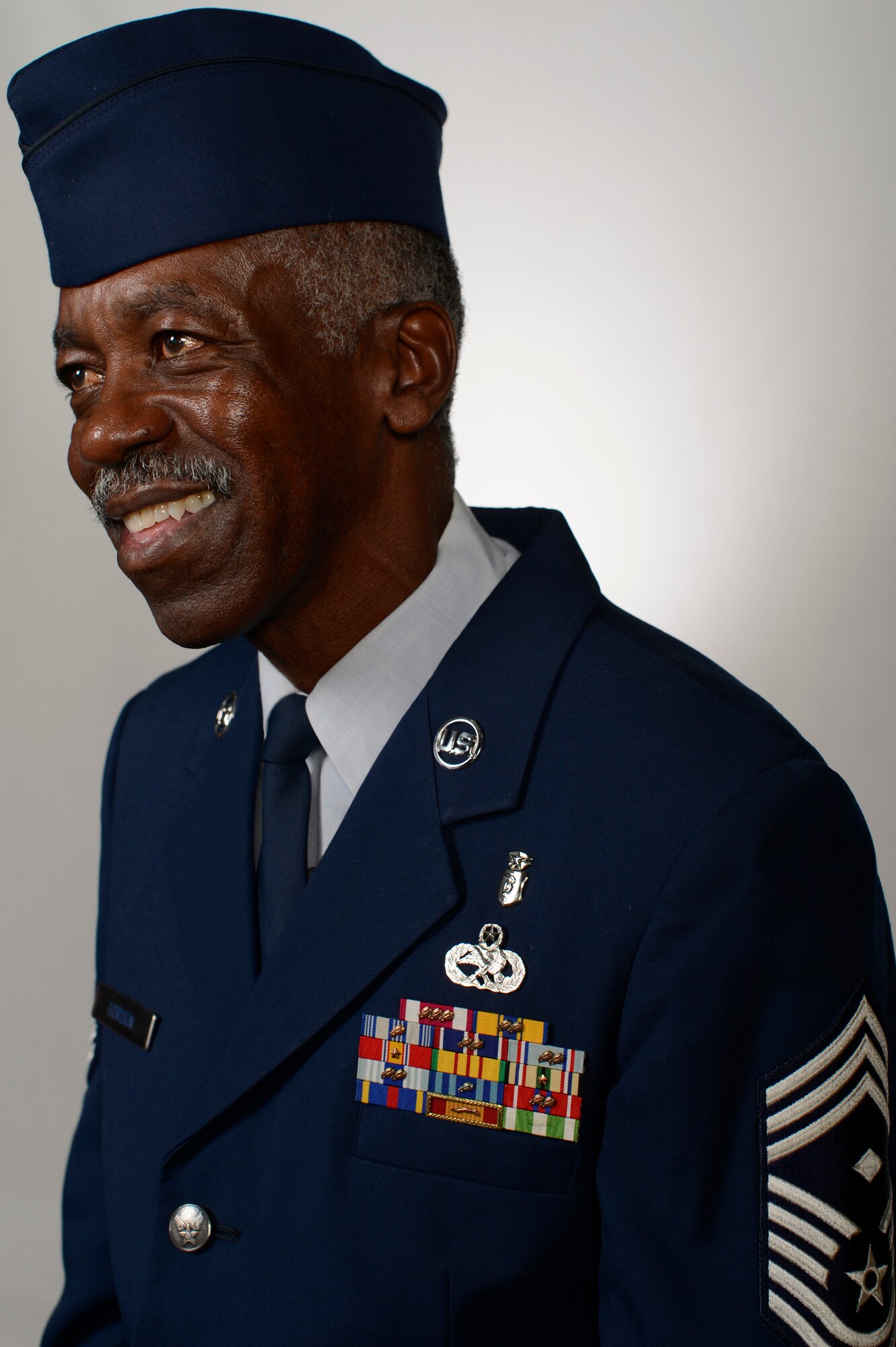 Retired U.S. Air Force Chief Master Sgt. Fred Gordon, 20th Fighter Wing Equal Opportunity chief, smiles while recollecting a memory at Shaw Air Force Base, S.C., Nov. 6, 2014. Gordon retired from the Air Force after serving 30 years, finishing his career as a first sergeant. (U.S. Air Force photo by Senior Airman Tabatha Zarrella/Released)