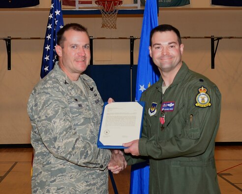 U.S. Air Force Col. Kenneth T. Bibb Jr., left, 100th Air Refueling Wing commander, awards U.S. Air Force Lt. Col. Michael Parks, 351st Air Refueling Squadron commander, with the Bronze Star Nov. 13, 2014, on RAF Mildenhall, England. Parks received the award for his actions as the 379th Air Expeditionary Wing chief of safety from June 5, 2013 to May 31, 2014. (U.S. Air Force photo by Airman 1st Class Jonathan Light/Released)
