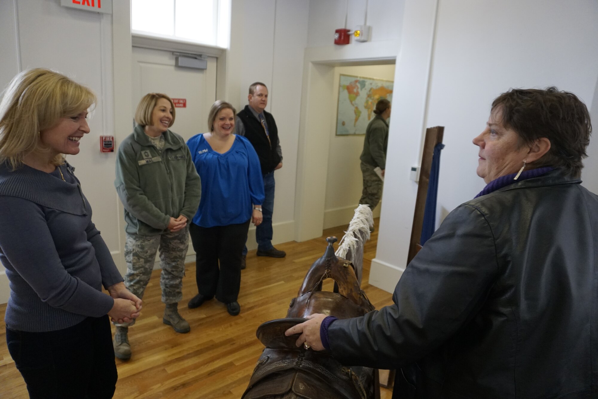 Paula Taylor, 90th Missile Wing museum curator, gives Chief Master Sgt. (Ret.) Athena Cody a tour of the Warren ICBM and Heritage Museum Nov. 15, 2015 at F.E. Warren Air Force Base, Wyo. The museum has various displays from Warren's History, including period style outfits and a retired peacekeeper missile. (U.S. Air Force photo by Lan Kim)