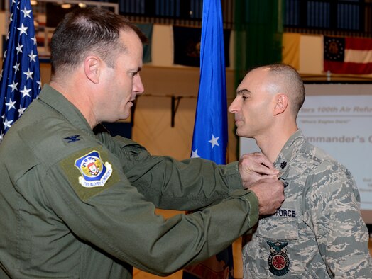 U.S. Air Force Col. Kenneth T. Bibb Jr., left, 100th Air Refueling Wing commander, pins a Bronze Star on U.S. Air Force Lt. Col. Kevin Parker, 100th Civil Engineer Squadron commander, during a commander’s call Nov. 14, 2014, on RAF Mildenhall, England. Parker received his Bronze Star for his accomplishments while in command of the 376th Expeditionary Civil Engineer Squadron June 20, 2012 to June 15, 2013, at Manas, Kyrgyz Republic. (U.S. Air Force photo by Senior Airman Kate Maurer/Released)