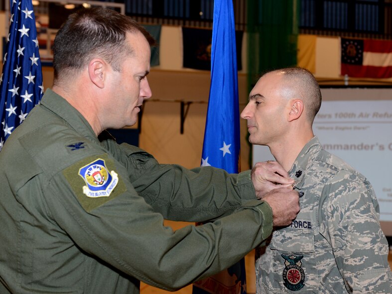U.S. Air Force Col. Kenneth T. Bibb Jr., left, 100th Air Refueling Wing commander, pins a Bronze Star on U.S. Air Force Lt. Col. Kevin Parker, 100th Civil Engineer Squadron commander, during a commander’s call Nov. 14, 2014, on RAF Mildenhall, England. Parker received his Bronze Star for his accomplishments while in command of the 376th Expeditionary Civil Engineer Squadron June 20, 2012 to June 15, 2013, at Manas, Kyrgyz Republic. (U.S. Air Force photo by Senior Airman Kate Maurer/Released)