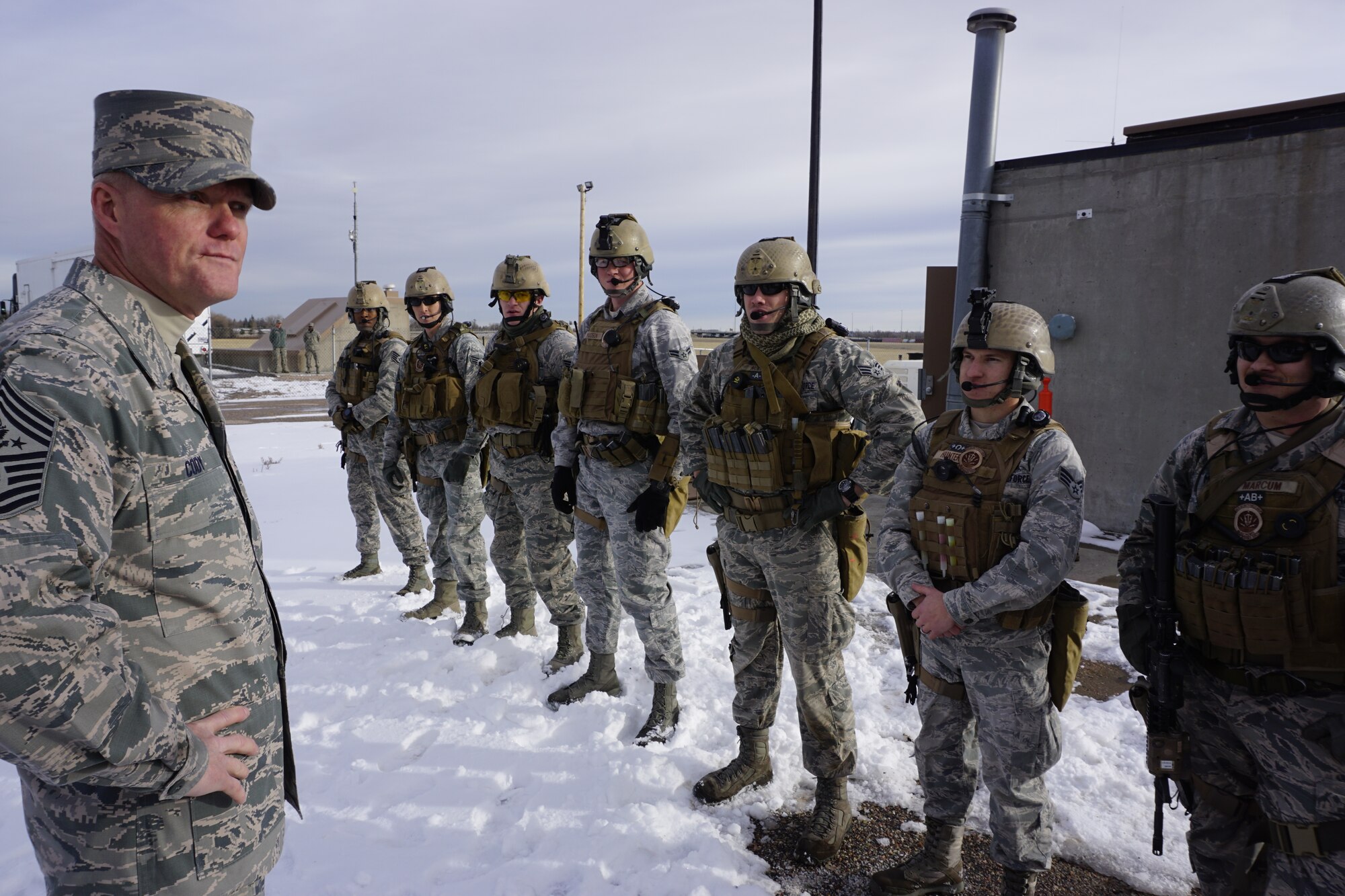Chief Master Sgt. of the Air Force James Cody speaks with 90th Security Forces Group Tactical Response Force Airmen Nov. 14, 2014 at F.E. Warren Air Force Base, Wyo. after they demonstrated their capabilities at the U-01 training launch facility. Cody said that TRF Airmen must be ready and alert every day, as their preparedness is vital to our nuclear deterrence mission. (U.S. Air Force photo by Lan Kim)
