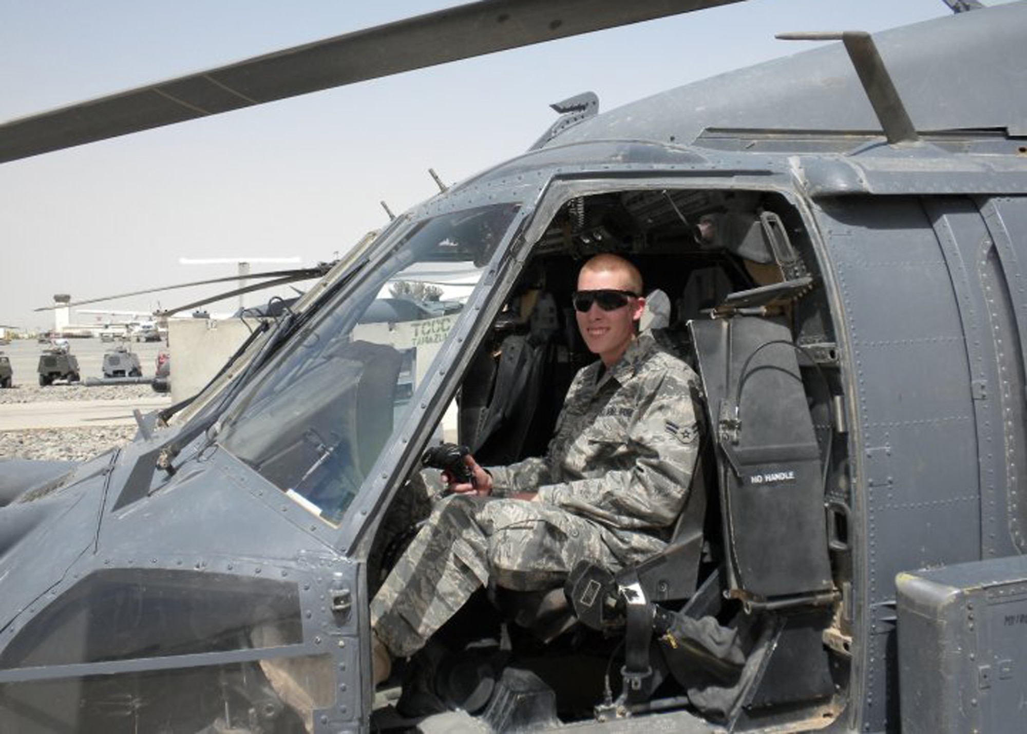 KANDAHAR AIRFIELD, Afghanistan. – Then Airman 1st Class Holden Montgomery, poses for a photo in the cockpit of a UH-60 Black Hawk aircraft during his deployment to Kandahar Airfield in 2010. As a result of his experiences while deployed, ‘Monty’ was diagnosed with post-traumatic stress disorder. Now receiving treatment for PTSD, Monty continues to serve his country doing the job he loves. (Courtesy photo)
