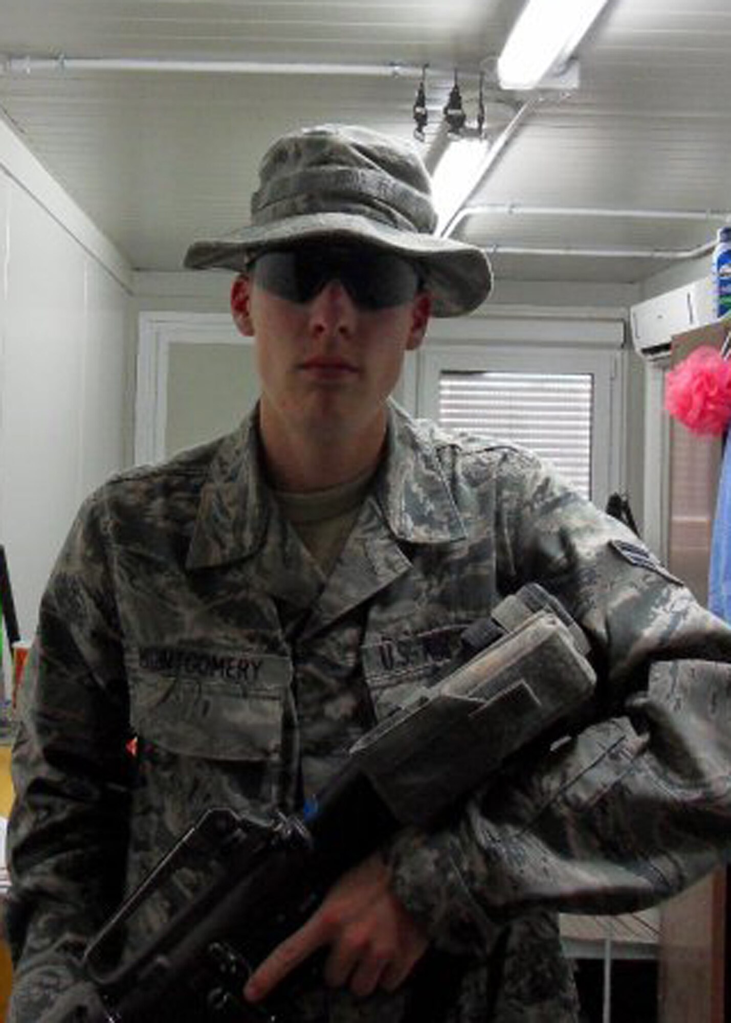 KANDAHAR AIRFIELD, Afghanistan. – Then Airman 1st Class Holden Montgomery, poses for a photo during his deployment to Kandahar Airfield in 2010. As a result of his experiences while deployed, ‘Monty’ was diagnosed with post-traumatic stress disorder. Now receiving treatment for PTSD, Monty continues to serve his country doing the job he loves. (Courtesy photo)
