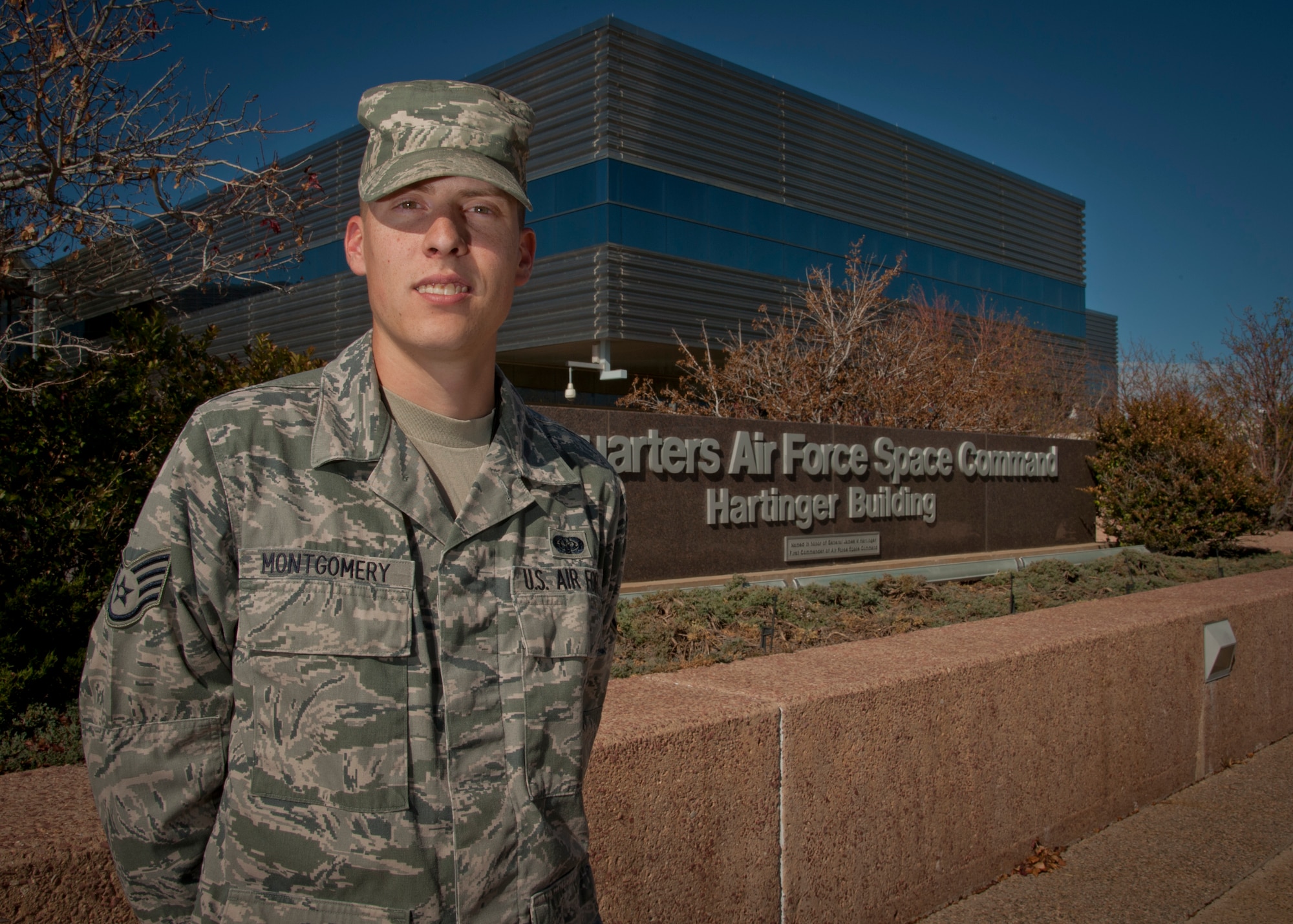 PETERSON AIR FORCE BASE, Colo. – Staff Sgt. Holden Montgomery, Air Force Space Command administration support technician, poses for a photograph outside of the Air Force Space Command headquarters building Oct. 29. ‘Monty’ deployed in 2010 to Kandahar Air Field, Afghanistan during which his base was subject to 86 rocket attacks and two ground attacks. As a result of his experiences he was diagnosed with post-traumatic stress disorder. Now receiving treatment for PTSD, Monty continues to serve his country doing the job he loves. Montgomery is one of the speaker’s in this year’s Storytellers event from 9-11 a.m. Nov. 21 in the ballroom at The Club. (U.S. Air Force photo/Staff Sgt. J. Aaron Breeden)