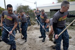 Naval Nuclear Power Training Command students fill sand bags Nov. 14, 2014, at the Vietnam Exhibit at Patriot’s Point in Mt. Pleasant, S.C. Hundreds of Joint Base Charleston Sailors and Airmen were participating in the United Way Day of Caring, which provides an opportunity for volunteer teams to partner with local agencies and schools to increase community engagement. NNPTC Sailors were at Patriot’s Point cleaning spaces onboard the aircraft carrier as well as painting, making sand bags for exhibits and cleaning the grounds. (U.S. Air Force photo/Eric Sesit)