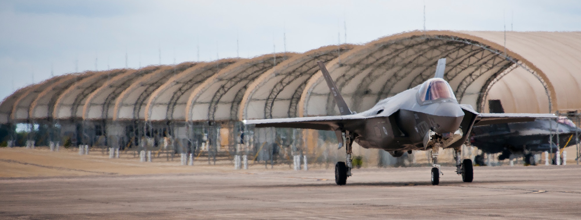 An F-35A Lightning II taxis down the 33rd Fighter Wing flightline after a sortie at Eglin Air Force Base, Fla.  The Air Force F-35s make of the majority of the joint strike fighters located on base.  (U.S. Air Force photo/Samuel King Jr.)