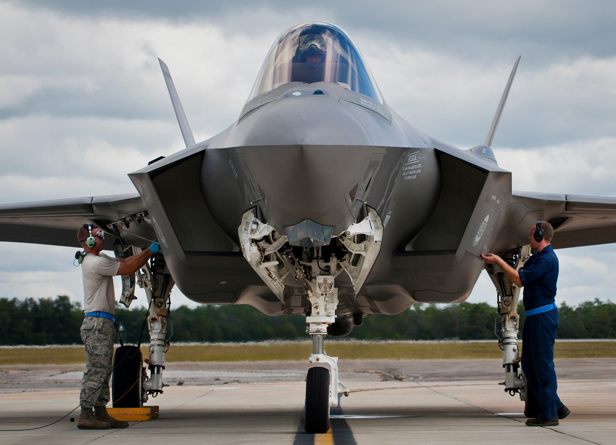 Airmen from the 33rd Maintenance Group perform checks on an F-35A Lightning II prior to a hot pit refueling session at Eglin Air Force Base, Fla.  All of the F-35 variants use the refueling areas in conjunction with the 96th Logistics Readiness Squadron’s fuels flight. (U.S. Air Force photo/Samuel King Jr.)