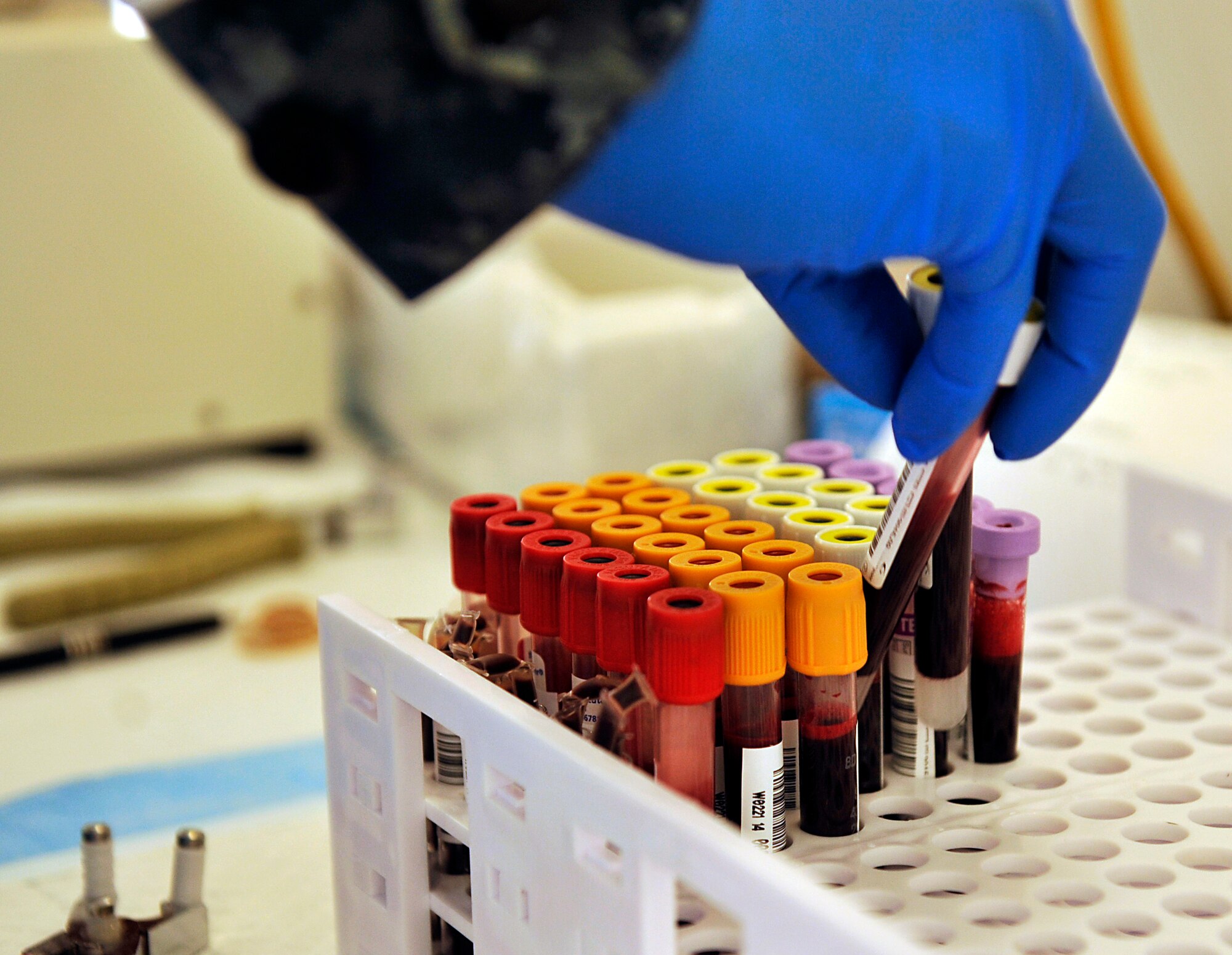 U.S. Navy Petty Officer 3rd Class Feliciano Paredes, Armed Services Blood Bank Center hospital corpsman, organizes blood samples from the day's patients at the Exchange on Kadena Air Base, Japan, Nov. 13, 2014. Donating blood regularly is important as it is only good for 42 days following donation, so blood drives held regularly like these help ensure there is an ample blood supply in the event of a crisis. (U.S. Air Force photo by Naoto Anazawa/Released)